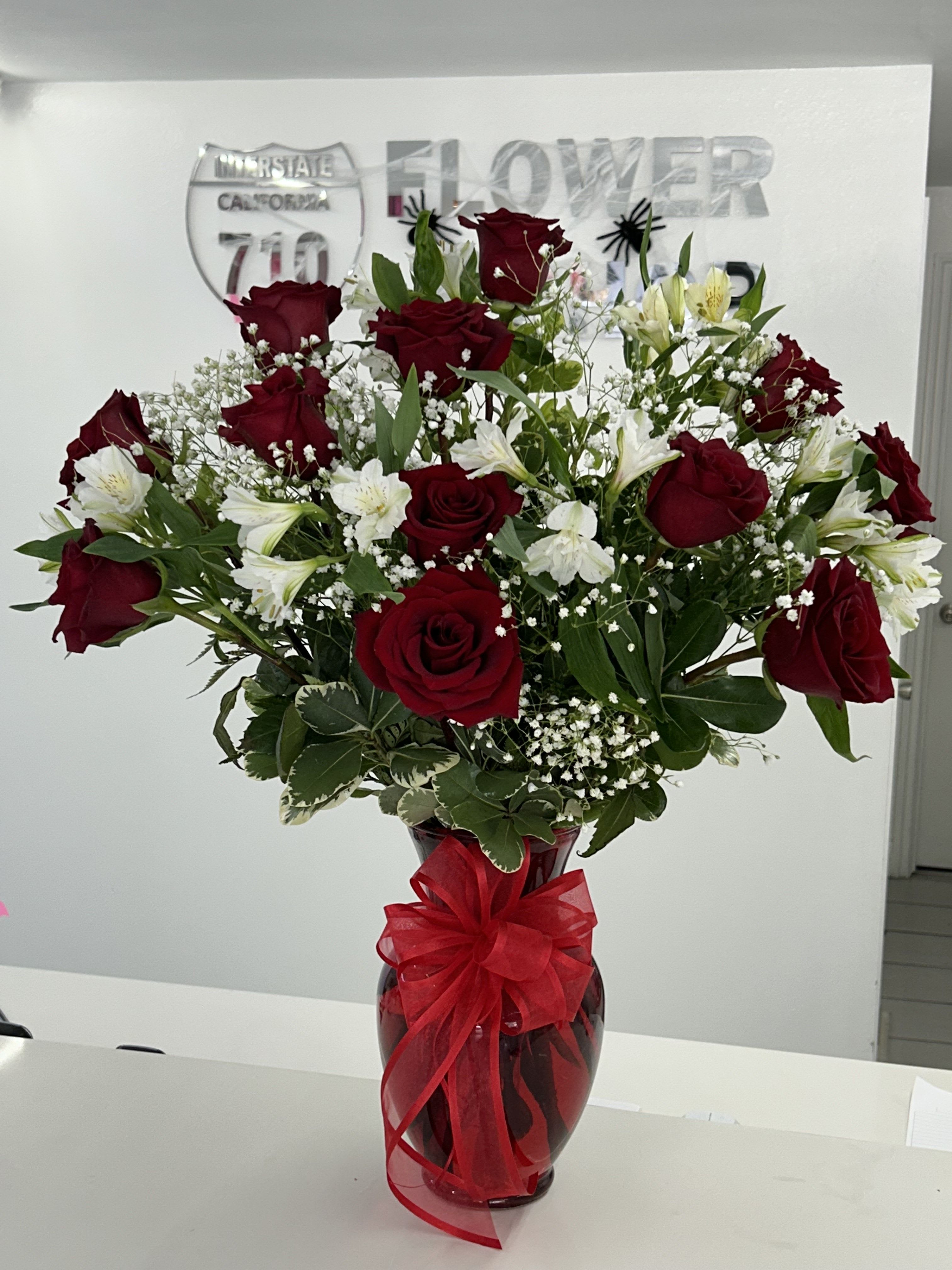 Sweetheart Blooms Sweetheart Blooms - Simple yet meaningful, this arrangement is the perfect way to remind someone they're loved-any day of the year! (If some flowers and/or the vase are not available there will be minor substitutions.)