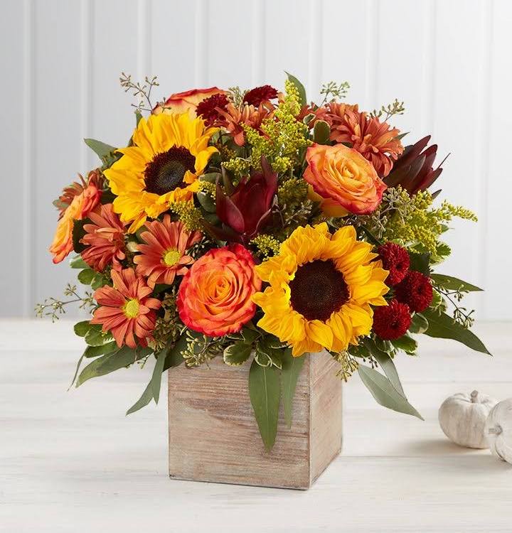 Harvest Glow - Round arrangement with roses safari sunflowers daises and solidago in a wooden box