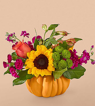 ***PUMPKIN WILL BE WHITE***     Bippity Boppity Pumpkin - Harvest the bell of the ball with our Bippity Boppity Bouquet designed with cheery sunflowers contrasting with purple carnations arranged in a novelty ceramic pumpkin.