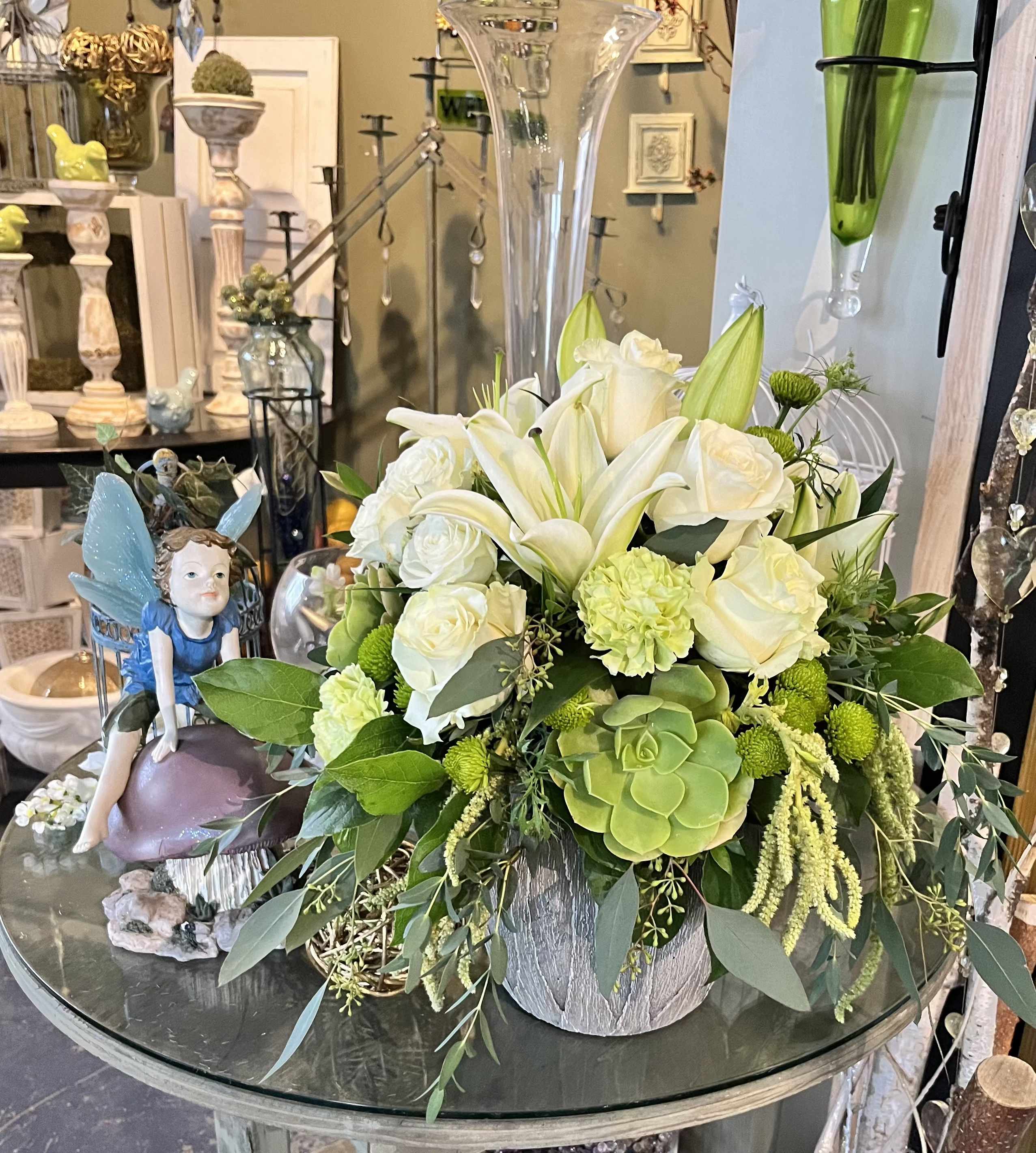 White Succulent - A mix of white and green blooms with  a touch of organic succulent make up this beautiful bouquet