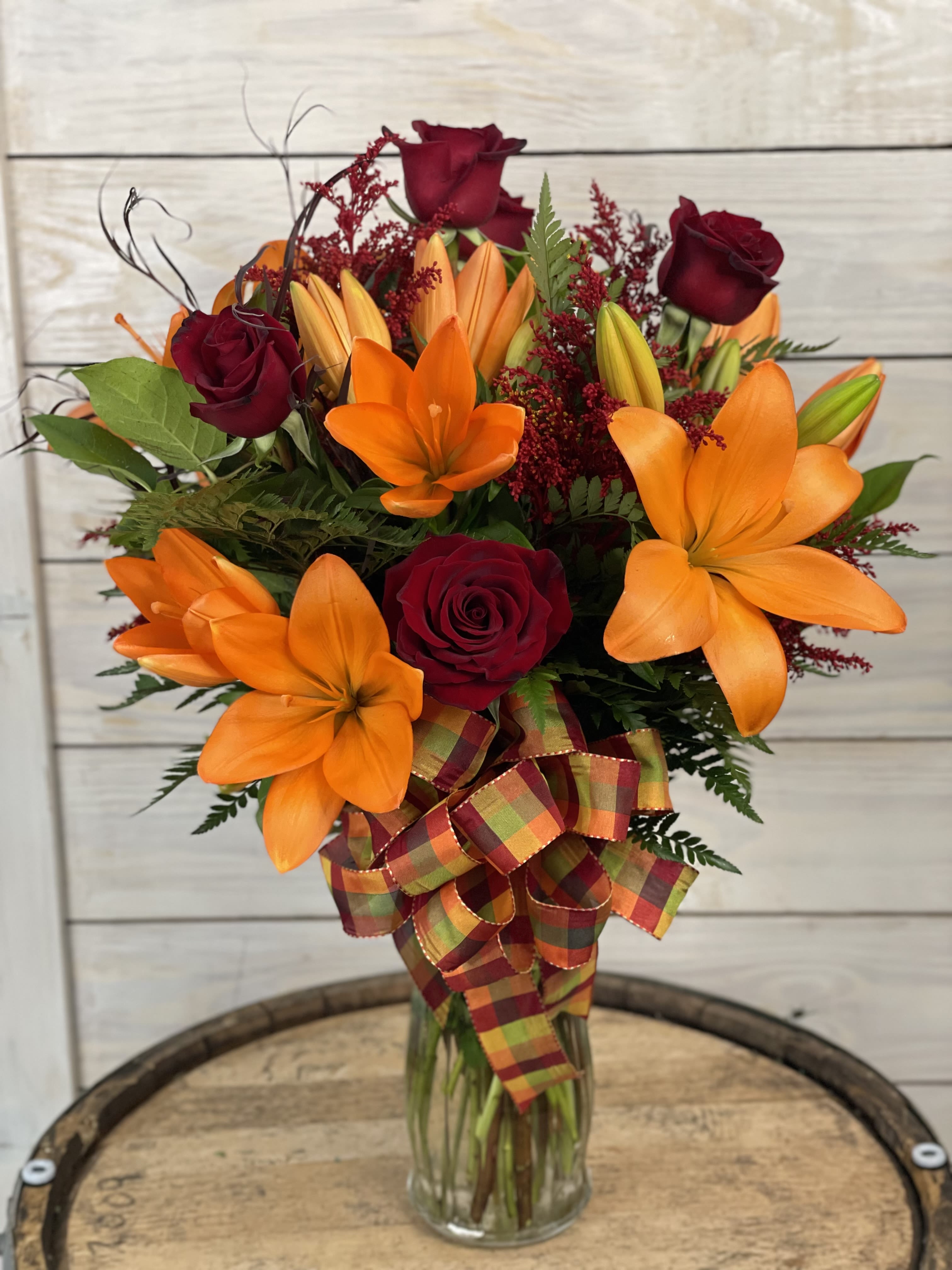 Lilies and Roses - Outstanding and stunning! 6 lilies and 6 roses in a vase with a mix of nice greenery.