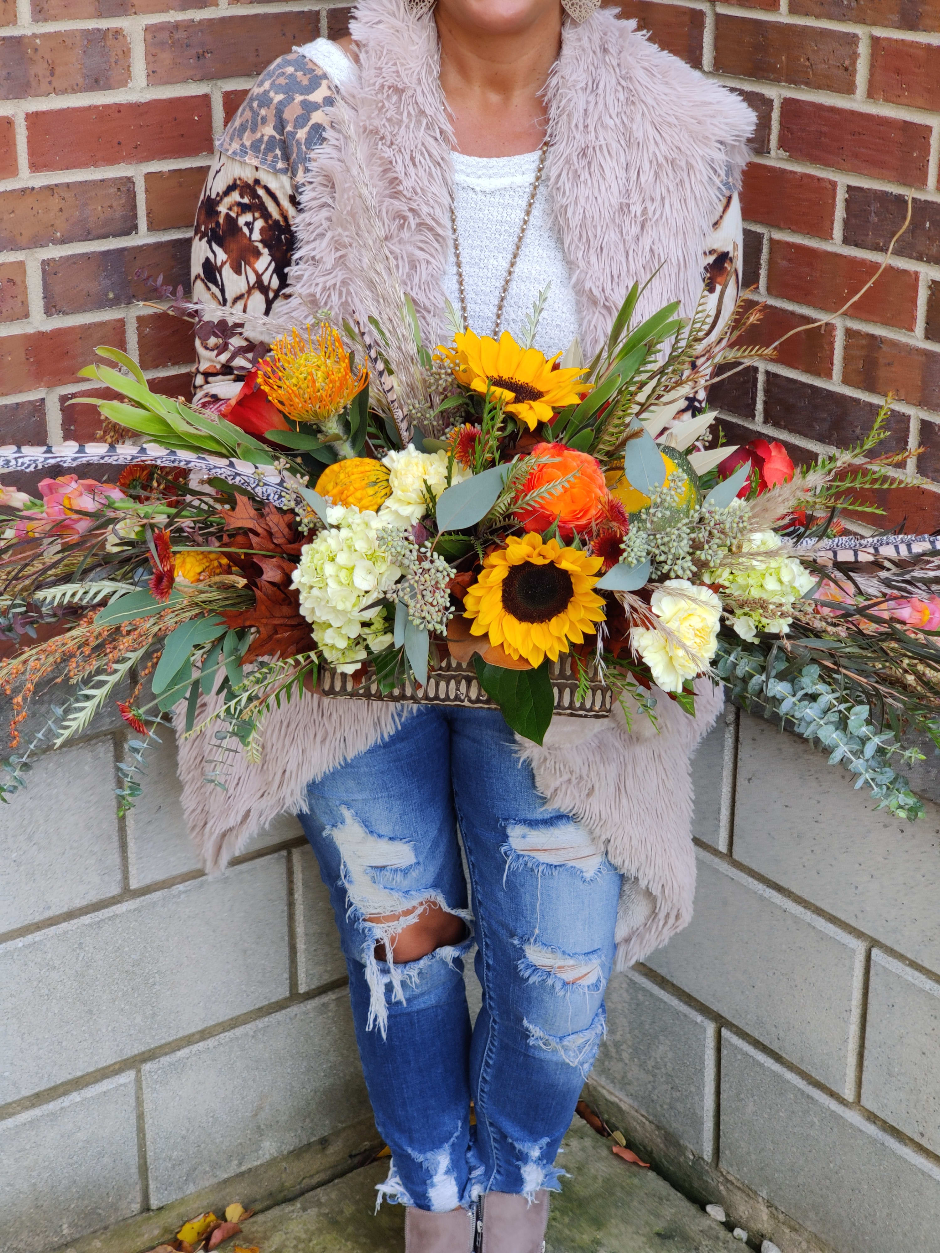 Autumn Brilliance Centerpiece Autumn Brilliance Centerpiece - Centerpiece full of color, textures, and assortment of flowers great for you gifts and gatherings