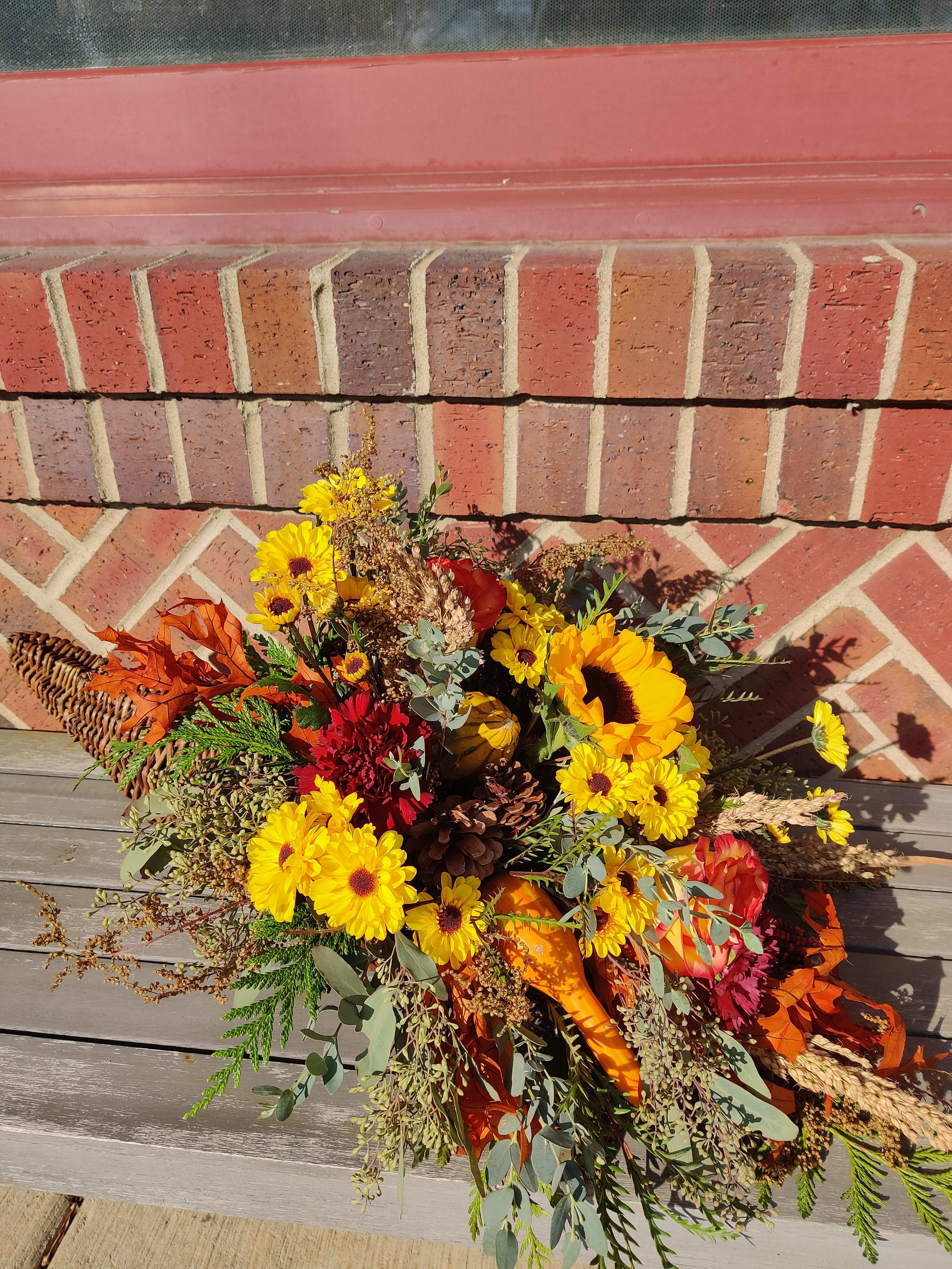 Cornucopia of Blessing - Great selection of fall harvest fills this beautiful grapevine cornucopia. The picture is the premium price point