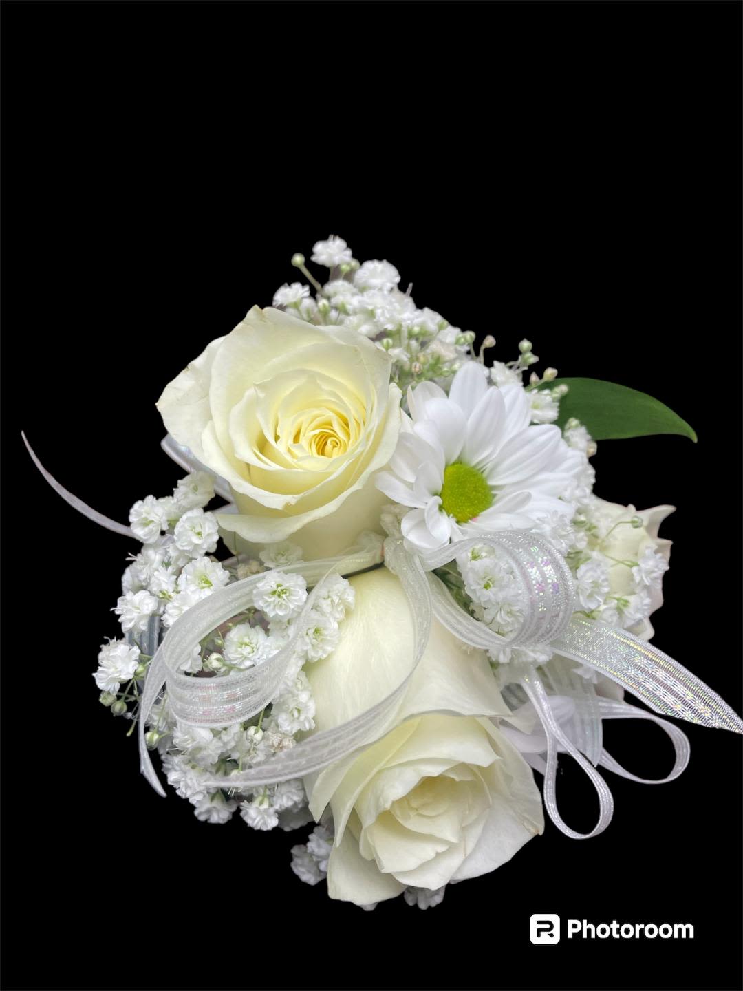 Boutonniere 13 - In some instances, our photo may represent an overall theme or look and include a one-of-a-kind vase which cannot be exactly replicated.  Although the actual bouquet may not precisely match the photo, its temperament will. Occasionally, substitutions of flowers and/or containers happen due to weather, seasonality and market conditions which may affect availability. If this is the case with the gift you’ve selected, we will ensure that the style, theme and color scheme of your arrangement is preserved and will only substitute items of equal value or higher value.  If any design elements are of major importance to your order, please include them in the florist instructions at checkout or contact us to ensure availability.