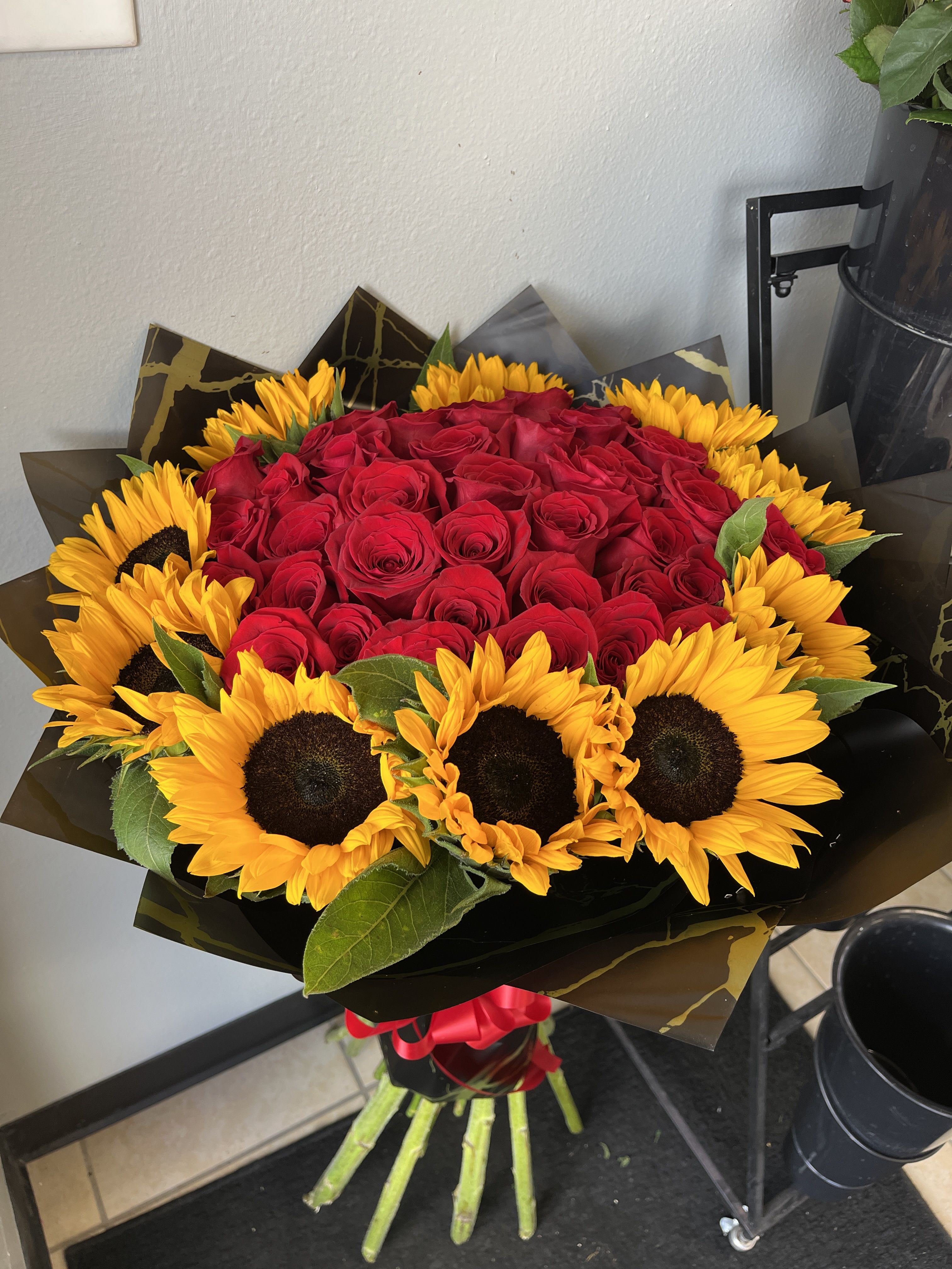 grand gesture  - averages 30 red roses with ten large sunflowers 