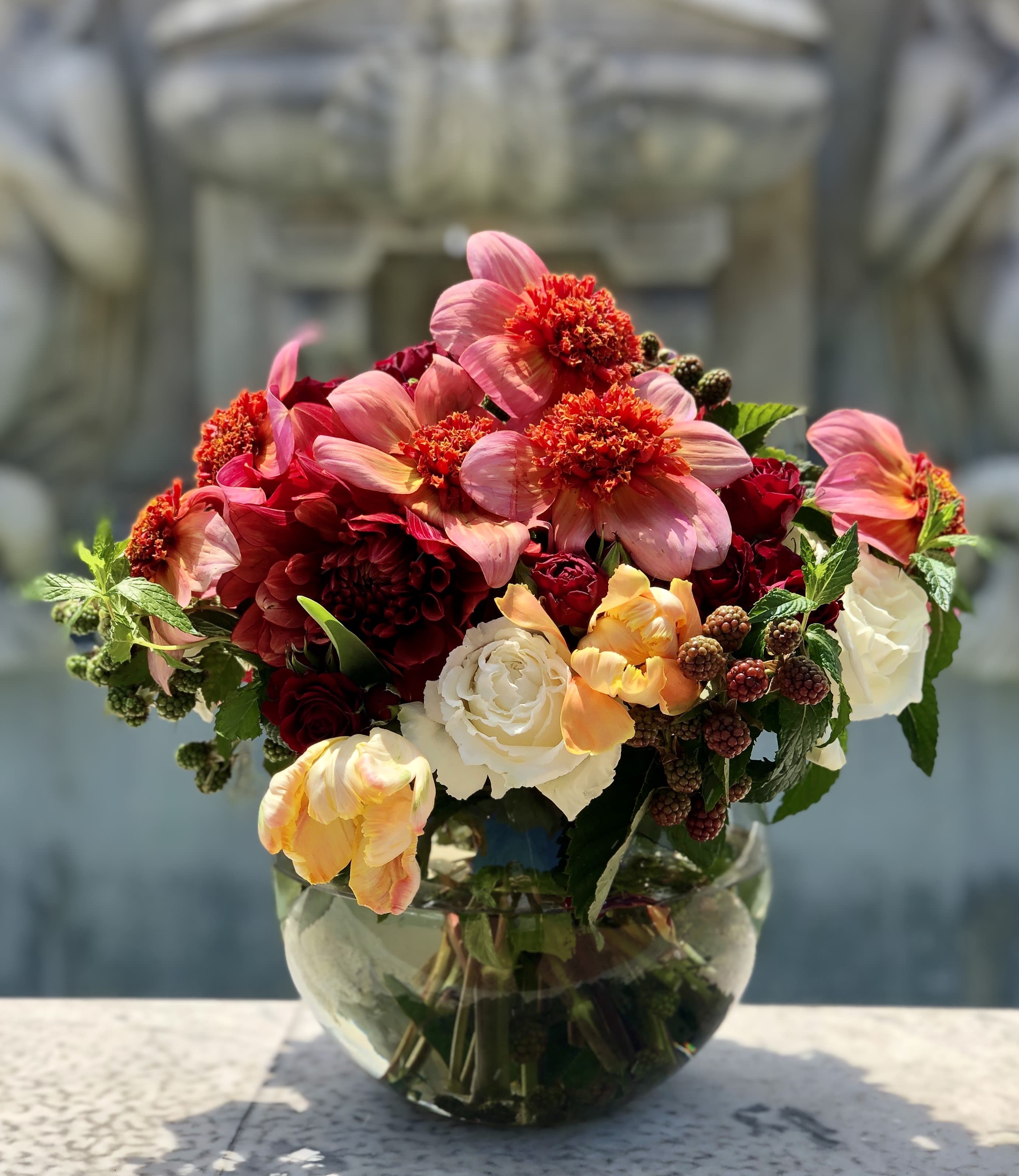 AUTUMN  AUTUMN  - Dahlia's are back in season! they are bold and beautiful and alive with color! This design is fresh and lovely and it sets the tone of those Fall nights that are right around the corner! It contains Dahlias and stunning tulips along with stunning white Playa Blanca roses.