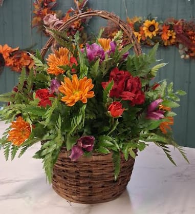 Harvest Basket Blooms Harvest Basket Blooms - Bring the warmth of the season indoors with our Harvest Basket Blooms. Designed in a rustic woven basket, this arrangement overflows with fresh fall seasonal flowers — a perfect nod to autumn’s natural beauty and charm. Please note: Flower varieties and colors may vary based on seasonal availability. Substitutions will be made with blooms of equal or greater value while maintaining the overall look and feel of the arrangement.