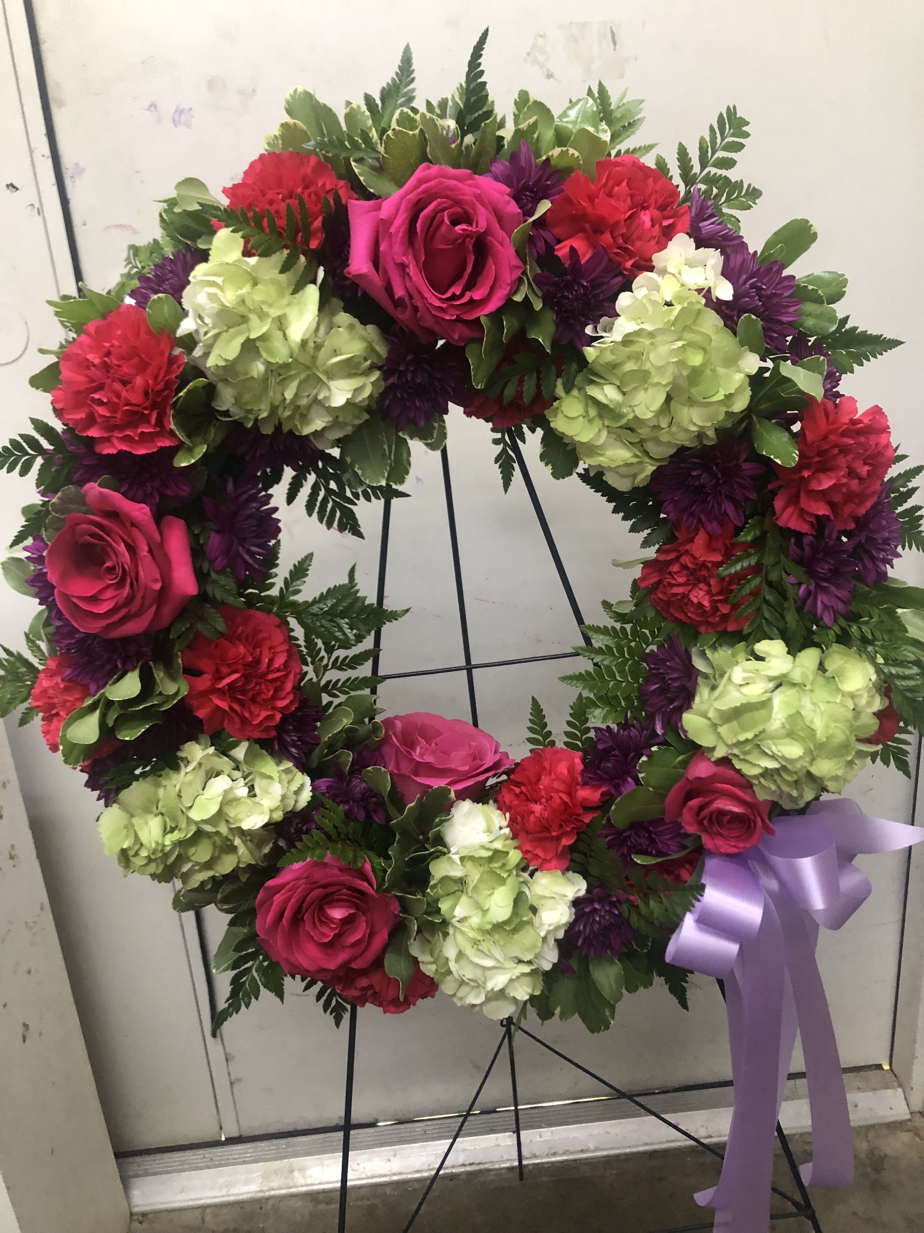 Hot Pink Ring Standing Spray Hot Pink Ring Standing Spray - Hot pink roses, reed carnations, and hydrangea in a circular design