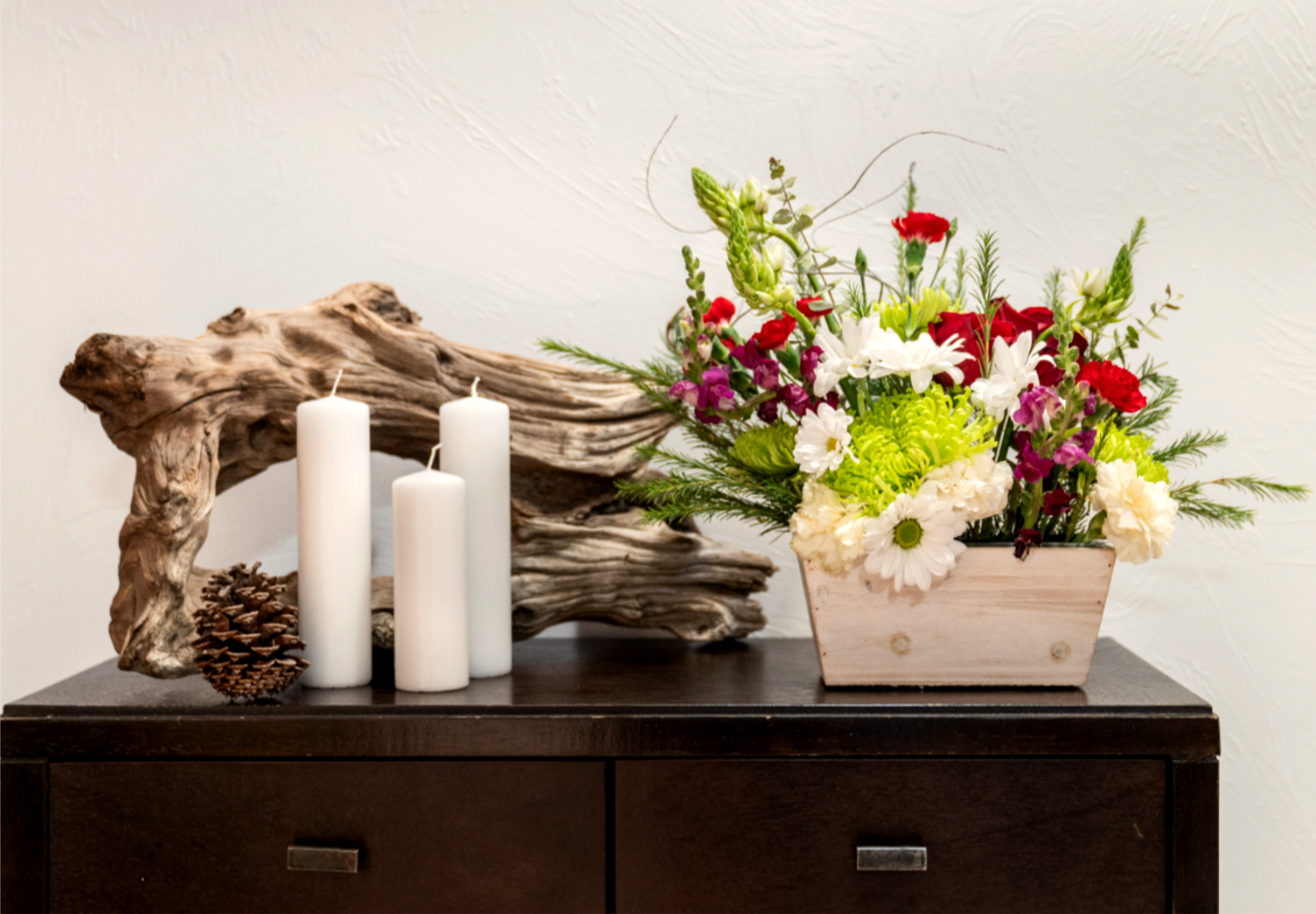 Peace On Earth Peace On Earth - This soft and airy take on Christmas and the Winter season not only presents elegance but a touch of peace too. With star of Beth, pine sprigs, green mums, roses and carnations this beauty will catch everyones eye.