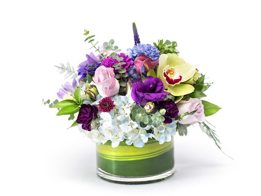 Purple Rain Purple Rain - Our best shades of purples and lavender, in honor of Prince. Designed in a vase and delivered by us, a real Portland florist to anywhere in the greater Portland Oregon area.