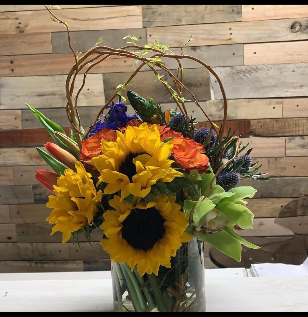 Grateful Wishes Grateful Wishes - Our Grateful Wishes is set in a cylinder with Sunflowers, poms, roses and other textures and colors make the perfect gift!