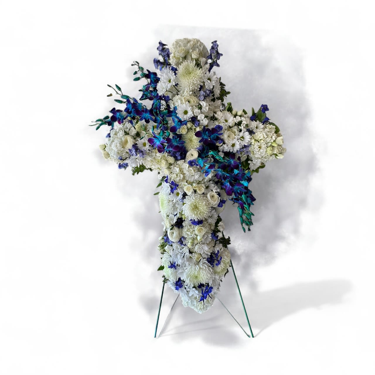 Blue and white cross Blue and white cross - white mums, and blue dendrobiums whit spray white roses, and ranunculus