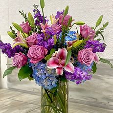 Lavender Dreams Bouquet Lavender Dreams Bouquet - Lavender Dreams Bouquet A graceful blend of soft lavender roses, vibrant purple stock, delicate stargazer lilies, and blue hydrangea creates this dreamy arrangement of color and fragrance. Presented in a clear glass vase, it’s the perfect gift to express love, admiration, or simply to brighten someone’s day with elegance and charm.