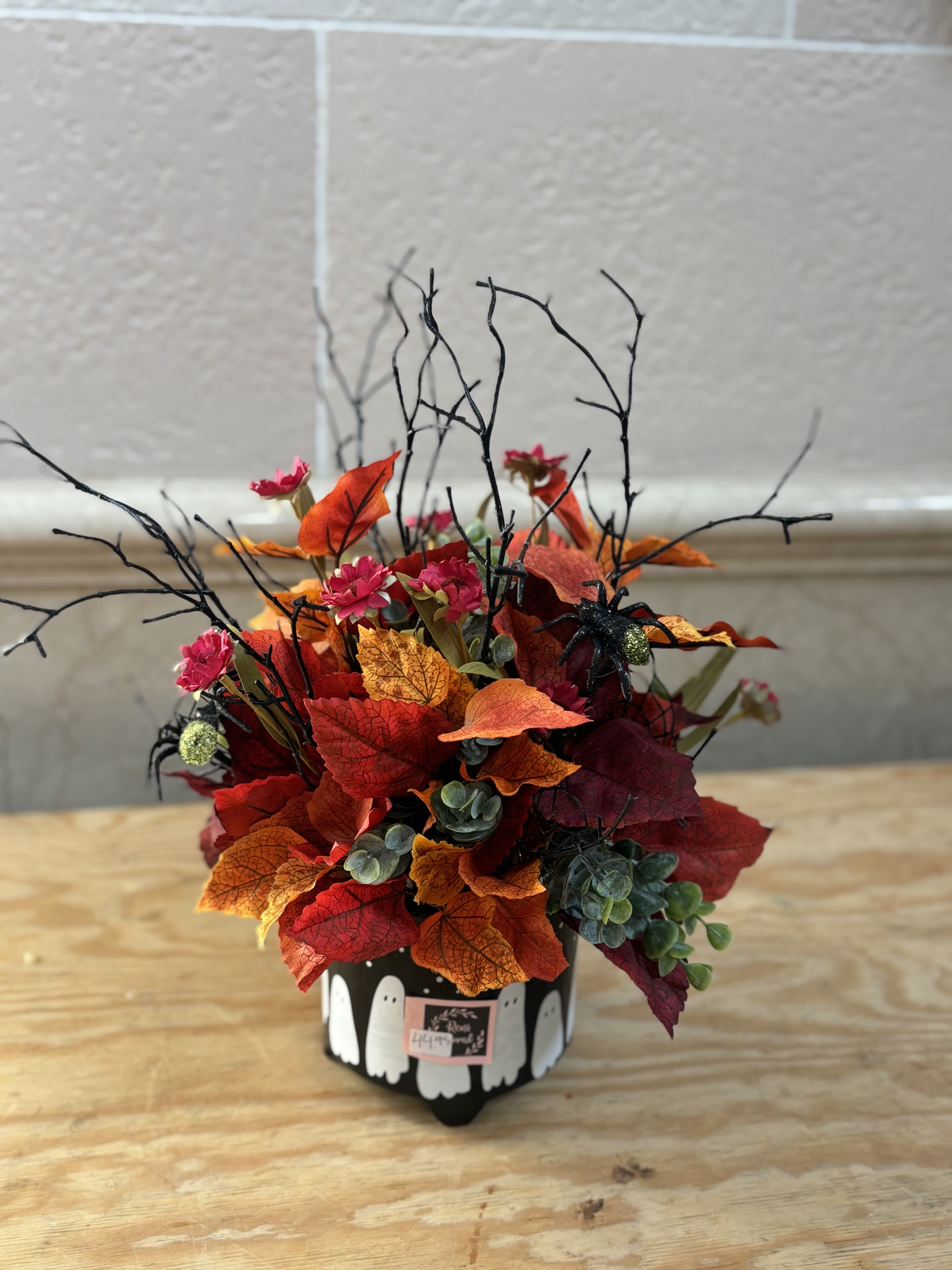 Casper the Artificial Arrangement  - A ghost container filled with fall artificial flowers. 