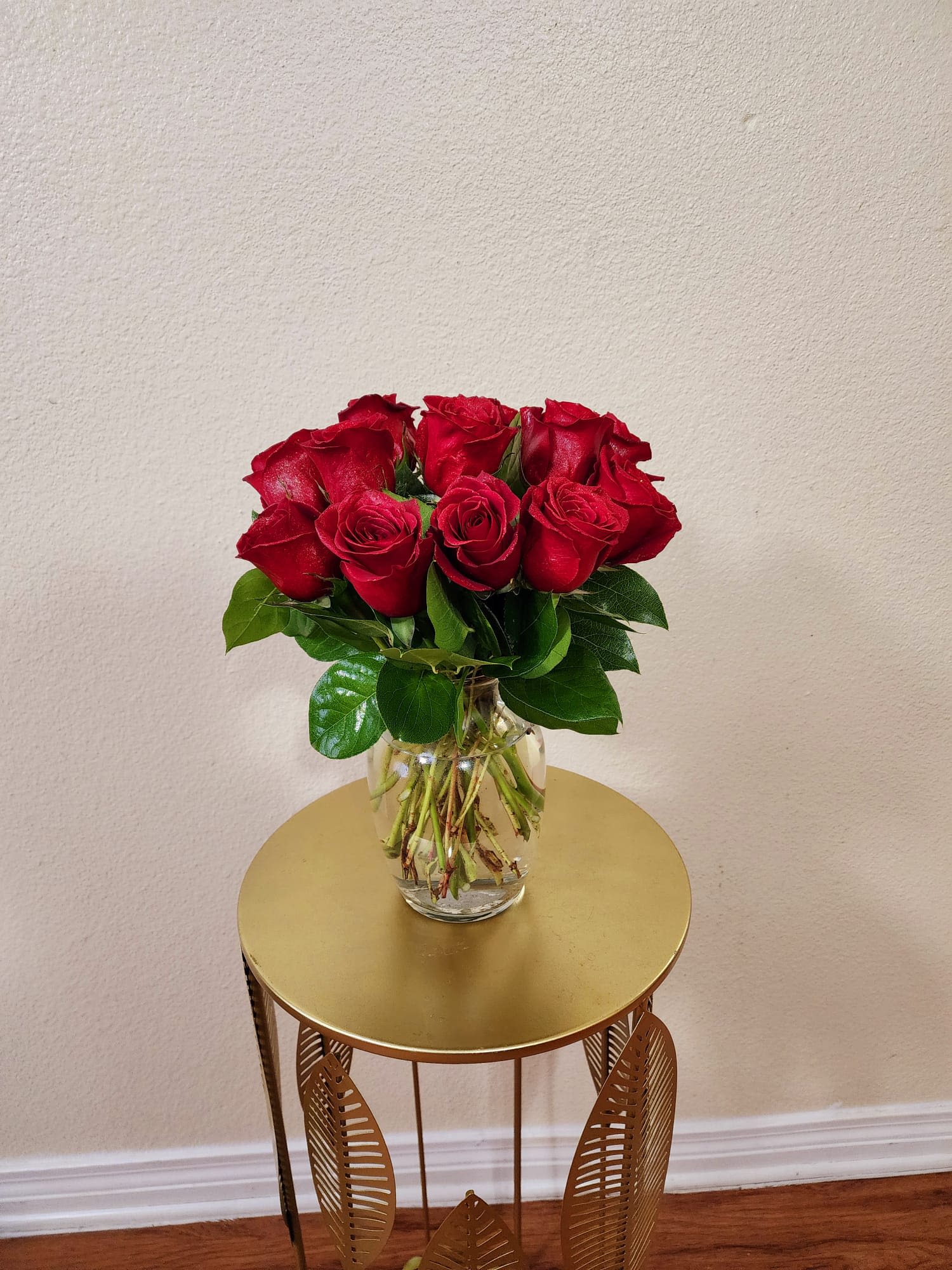 She's Rose - Roses in a clear vase with some greens in it, a classic that never fails.