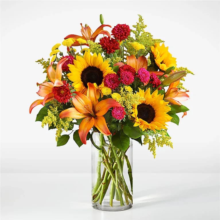 Cobblestone Bouquet - As classic as a cobblestone street, this bouquet includes the season's favorite florals like sunflowers, lilies and solidago.