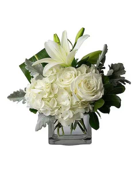 Pearl - Cultured beauty. Pearl is an exquisite expression of love. Flowers like Roses, Hydrangea, and Lilies are mixed with fun greens in this cube.