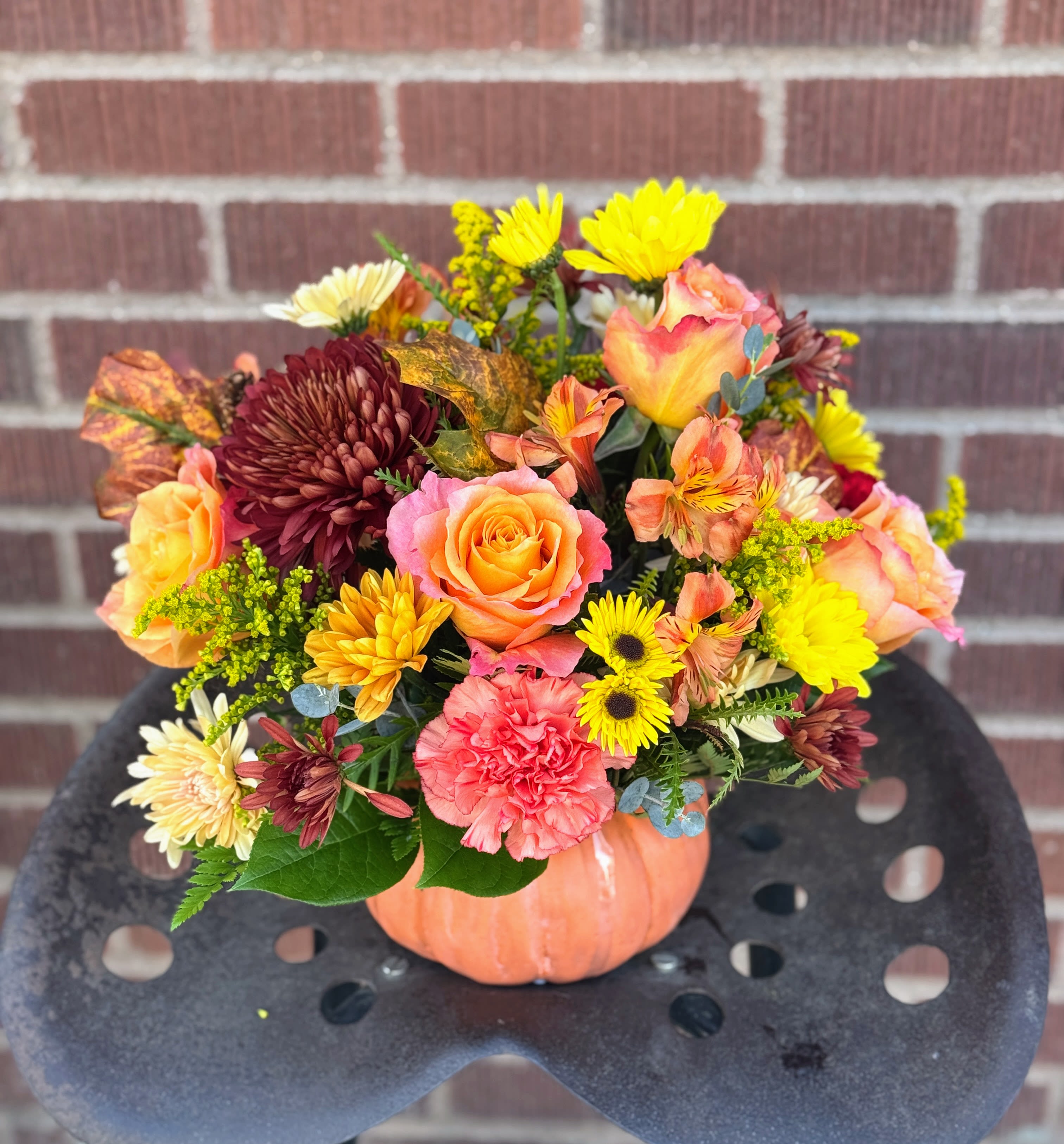 Warm Fall Wishes Warm Fall Wishes - Celebrate the beauty of fall with this colorful, heartwarming mix of roses and alstroemeria, hand-delivered in our classic ceramic pumpkin. Product ID: T13H110A
