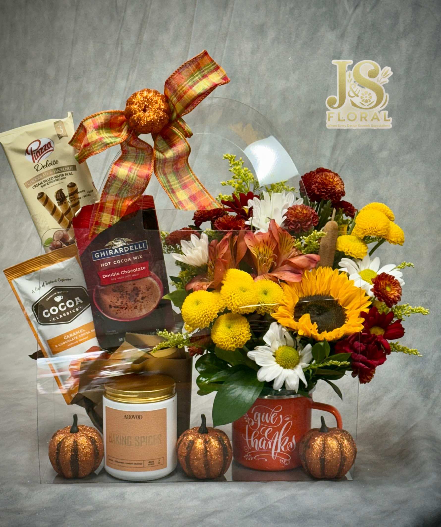 Mug Melt and Blooms - A cozy little bundle of joy! Each bag includes a fresh floral arrangement beautifully styled in a keepsake mug, paired with a delicious cocoa mix and a fall-scented candle melt — perfect for gifting or treating yourself this season. 