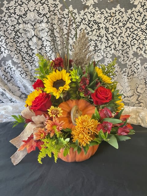 PUMPKIN PATCH PUMPKIN PATCH - A handpicked selection of a variety of beautiful, fall toned fresh flowers thoughtfully designed in an orange ceramic pumpkin that can be used as fall home décor for years to come.