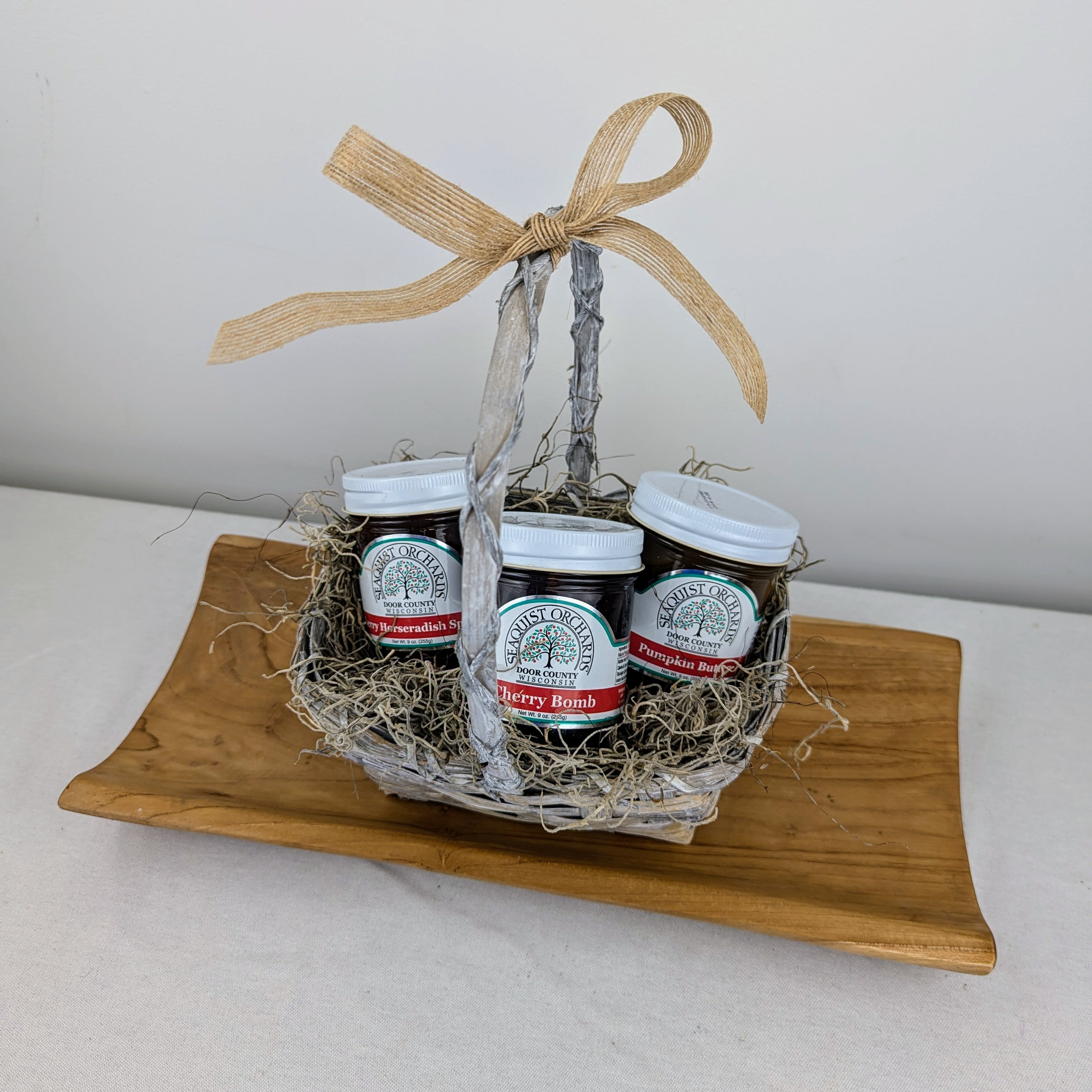 SeaQuist Orchards Gift Basket - Variety of SeaQuist Orchards goods, nestled in a basket adorned with ribbon and wrapped in cellophane