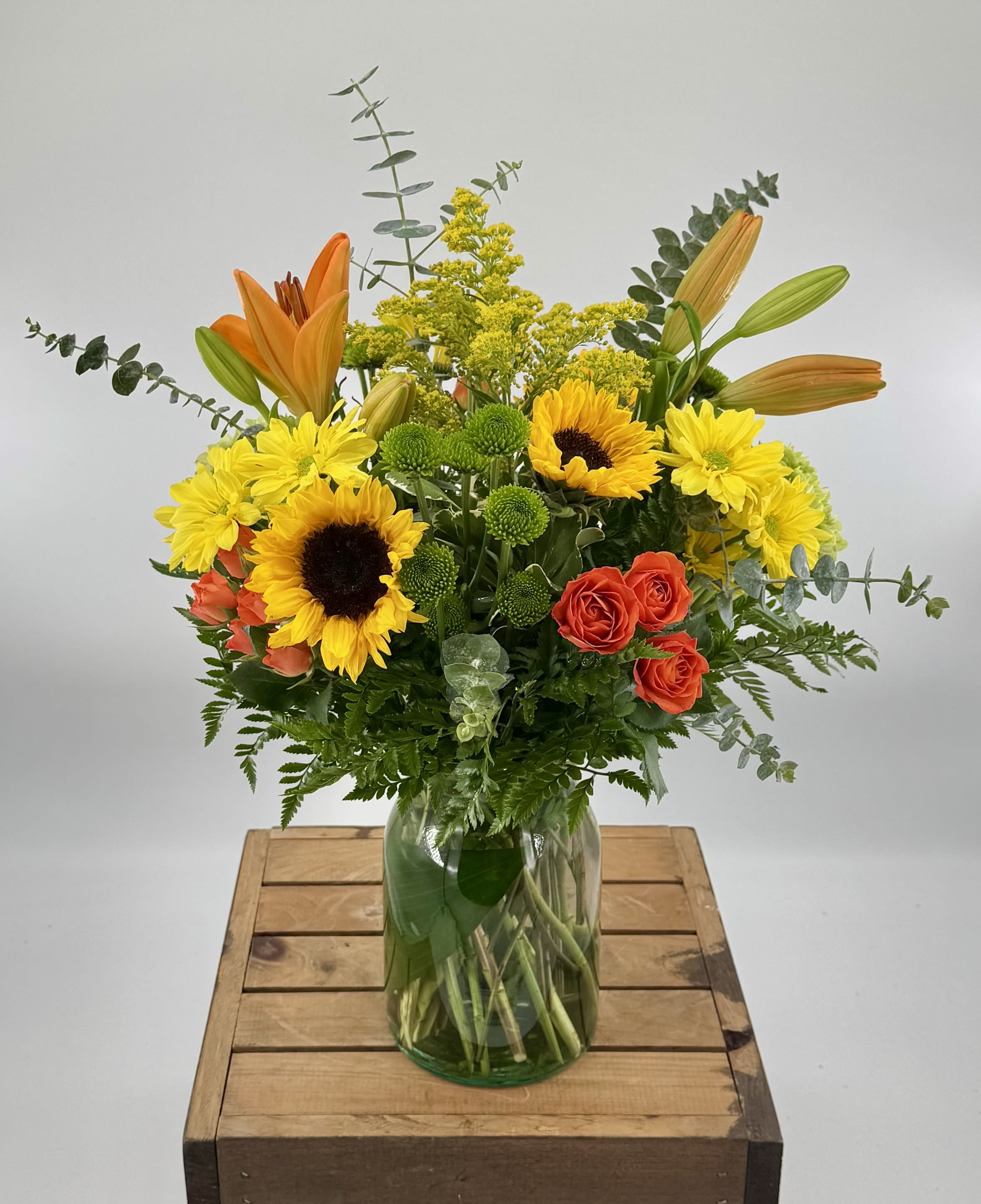 Thankful for You (BR) Thankful for You (BR) - Celebrate the spirit of gratitude and appreciation with our "Thankful for You" floral arrangement. Expertly curated with a mix of vibrant orange lilies, sunflowers, orange spray roses, green button poms.This arrangement is perfect for Thanksgiving, autumn, and fall.