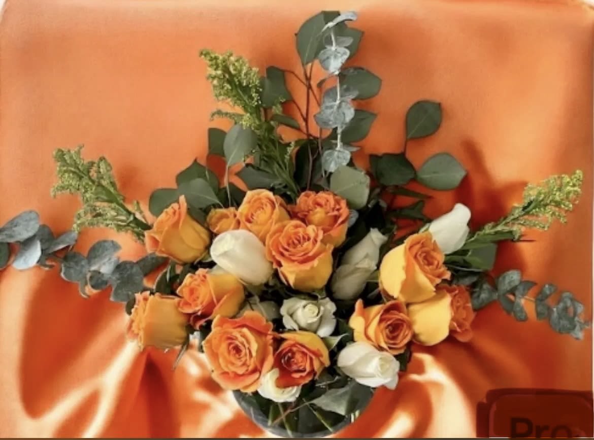 Bright Horizons By Shelly - Bright, bold, and full of joy — this rose arrangement is designed to bring warmth and elegance into any space. The radiant blend of golden and ivory tones is complemented with fresh greenery, creating a look that’s both uplifting and refined. Perfect as a thoughtful gift, centerpiece, or a way to celebrate life’s most meaningful moments.