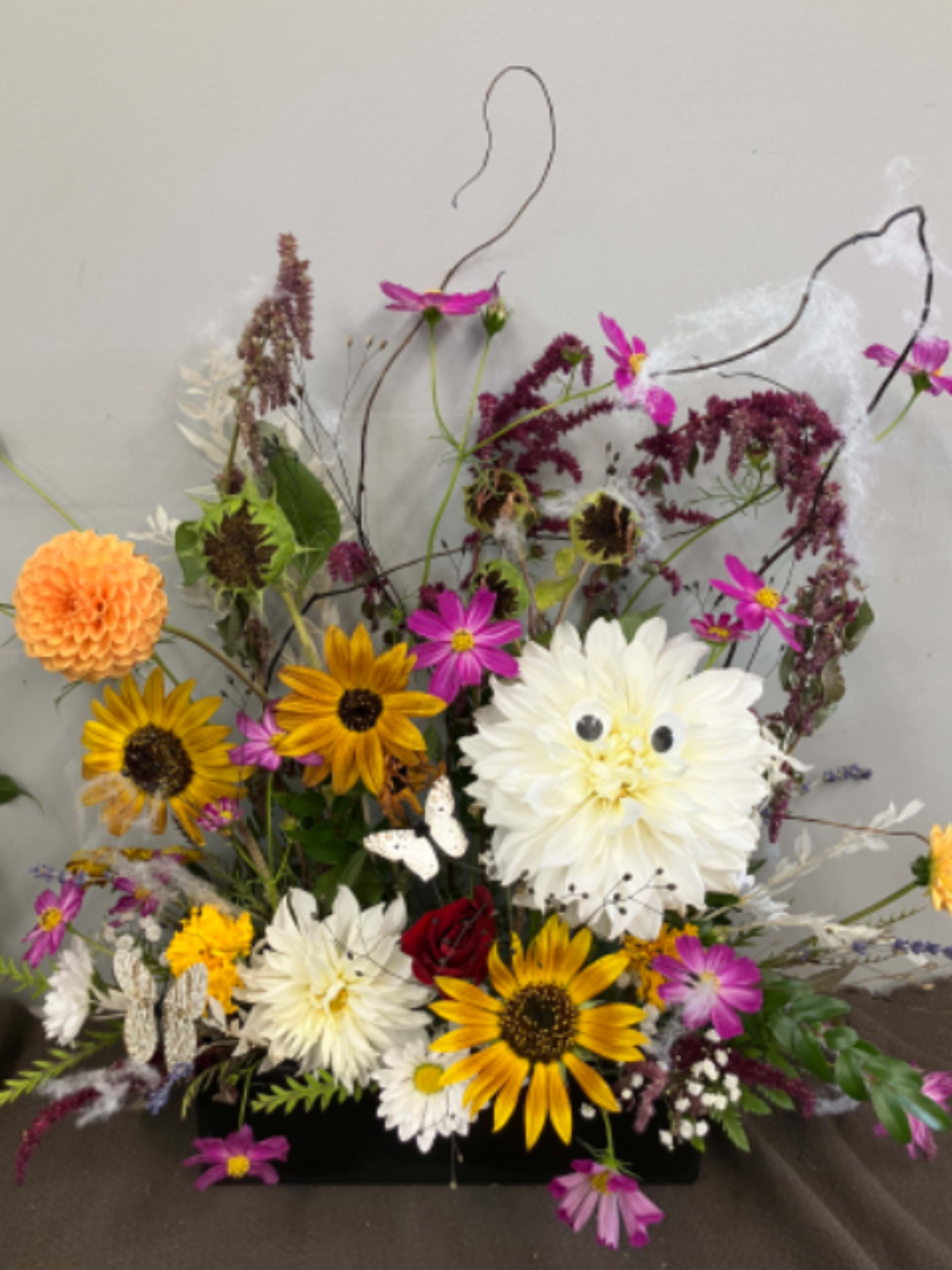 It’s Spooky Season It’s Spooky Season - Funky flowers for October! Bright and bold arrangement perfect for the autumn season set in a black ceramic container