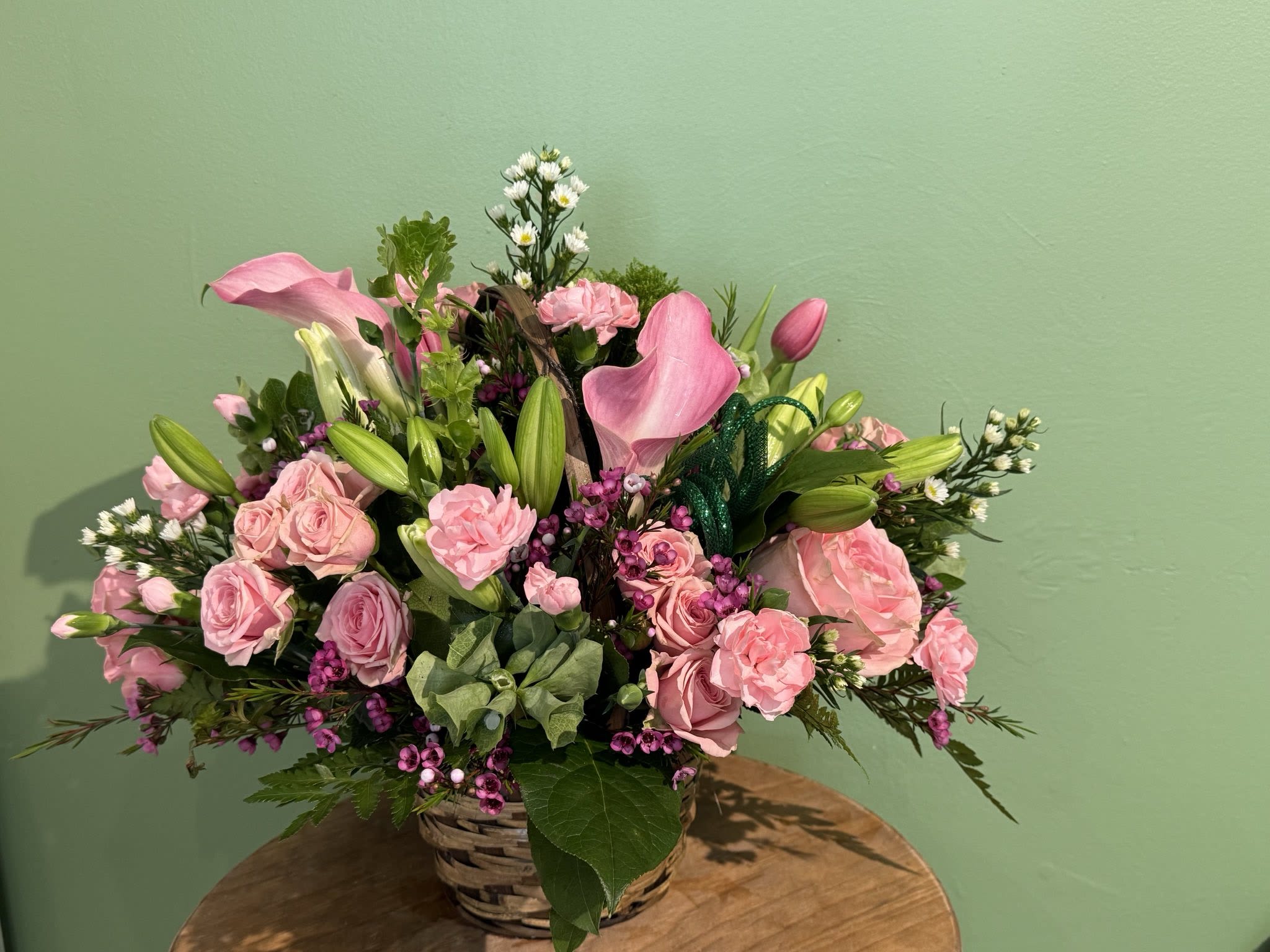 Radiant Spirit Radiant Spirit - This arrangement brings a rustic feeling with a willow basket base. *Be aware that due to a global flower shortage not all colors are going to be the same as pictured*