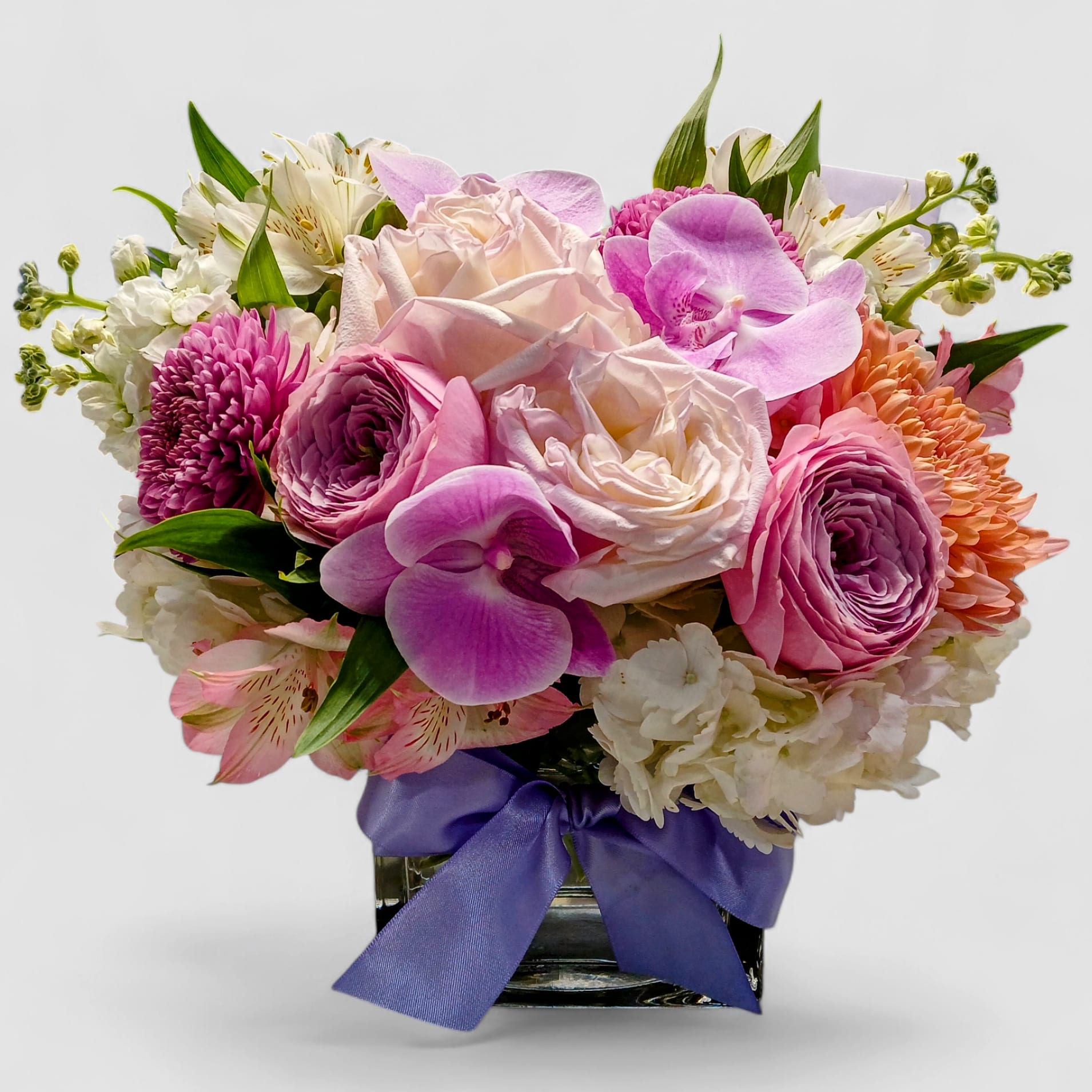 Lavender & Pink Elegance Bouquet - Roses, Hydrangeas & Orchids | Haddonfield & Haddon Township Delivery Lavender & Pink Elegance Bouquet - Roses, Hydrangeas & Orchids | Haddonfield & Haddon Township Delivery - Delight them with the Lavender & Pink Elegance Bouquet, a lush blend of roses, orchids, hydrangeas, and seasonal blooms arranged in a chic glass vase accented with a lavender satin bow. This bouquet is perfect for celebrating birthdays, anniversaries, congratulations, or just because, bringing soft romance and timeless beauty to any occasion. Handcrafted with care by Joey-Lynn's Flowers, each arrangement is designed to be extra special and one-of-a-kind. Available for same-day flower delivery in Haddonfield, Haddon Township, Cherry Hill, Marlton, and nearby towns. Send elegance, beauty, and love today.