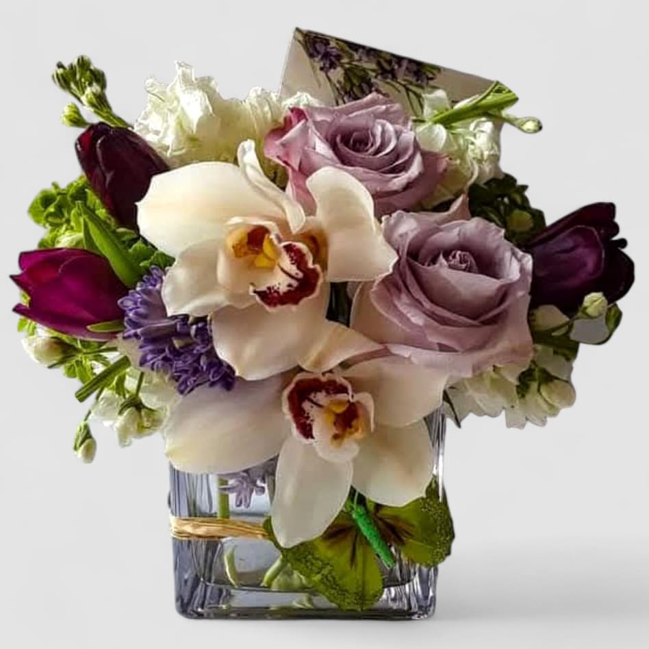 Lavender & Violet Orchid Birthday Bouquet - Designer's Choice Bestseller Lavender & Violet Orchid Birthday Bouquet - Designer's Choice Bestseller - Celebrate life's most special moments with our Lavender & Violet Orchid Birthday Bouquet, a bestselling designer's choice arrangement bursting with elegance and charm. Featuring enchanting lavender roses, violet orchids, and seasonal blooms, this hand- designed arrangement is a true expression of beauty and sophistication. Each bouquet is uniquely crafted by our floral designers, so no two are ever exactly alike- making your gift as special as the person receiving it. The striking blend of lavender and violet tones created a vibrant yet graceful palette that's perfect for birthdays, anniversaries, or simply to brighten someone's day. Why it's a favorite: * Includes luxurious lavender roses and exotic orchids * Designed fresh and unique each time by our studio * A customer favorite and one of our most popular birthday bouquets We proudly deliver locally to Haddonfield, Haddon Township, Cherry Hill, Marlton, Voorhees, Mount Laurel, and surrounding South Jersey towns. Send this signature bestseller today and let it's unforgettable colors bring joy, beauty, and smiles.