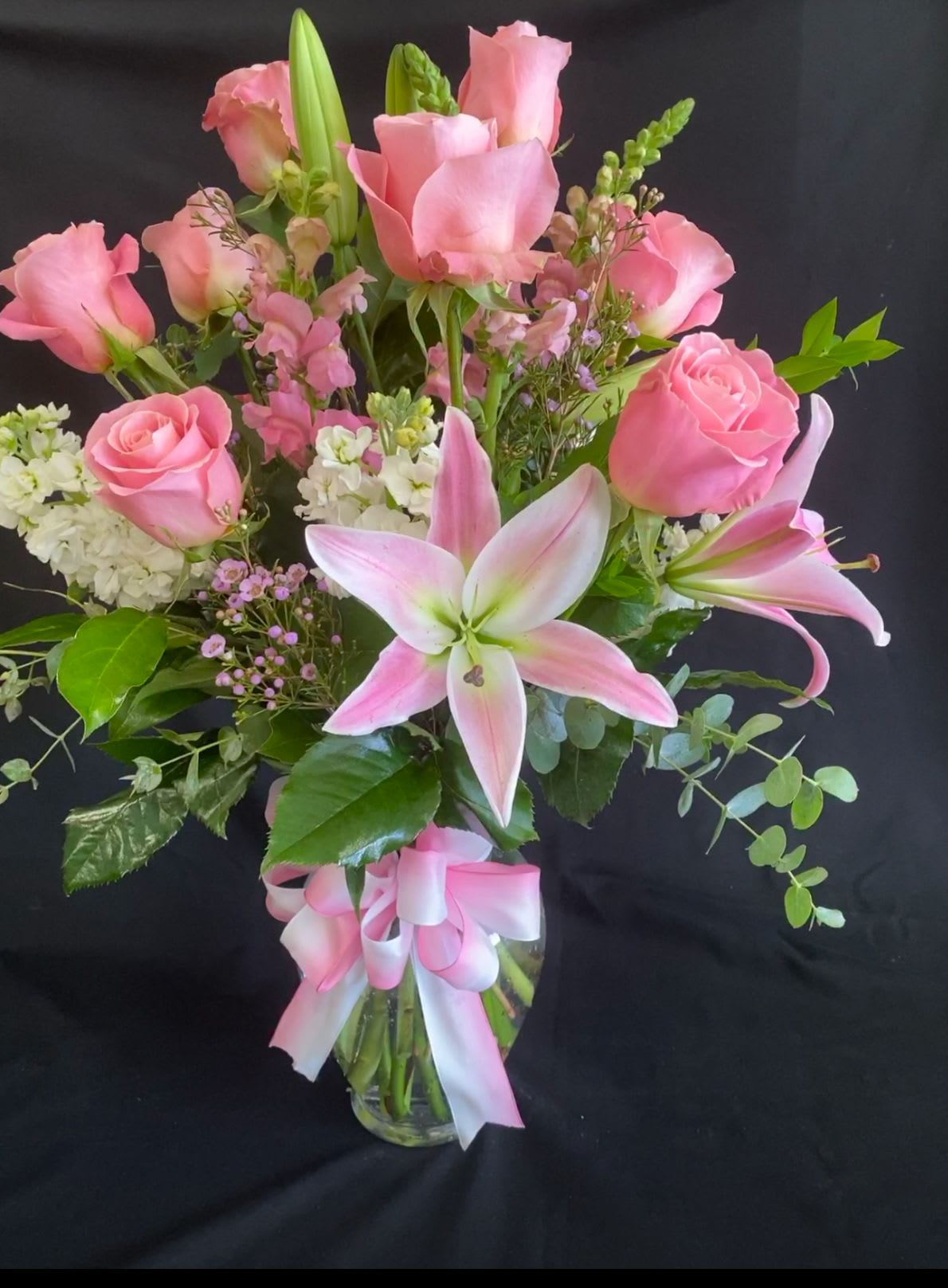 You make me smile - vase with pink and white flowers stargazers, snap dragons, stock, roses , wax flower and mixed greens