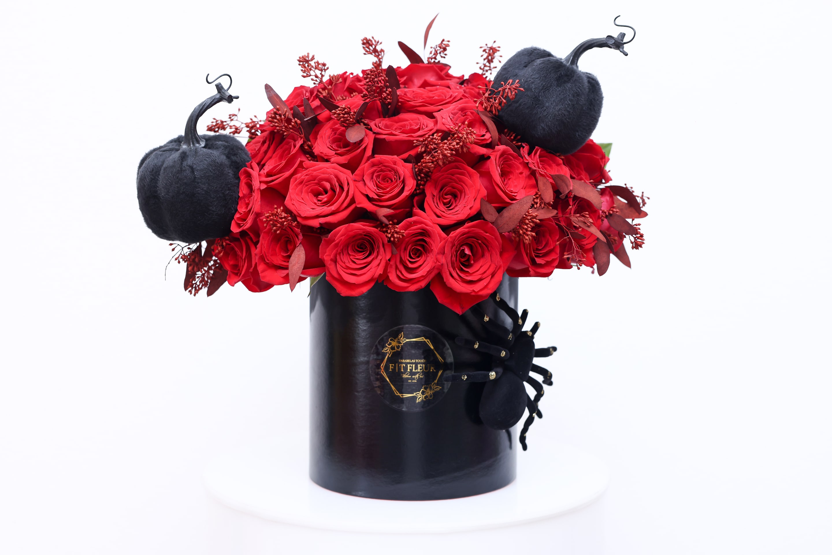 Wednesday - Halloween inspired Hat box arrangement designed with red roses all around.   Due to the seasonality of flowers or supply chain issues, substitutions may occasionally need to be made. While we understand this is an inconvenience, we will fill your order with an arrangement of similar color and design style.