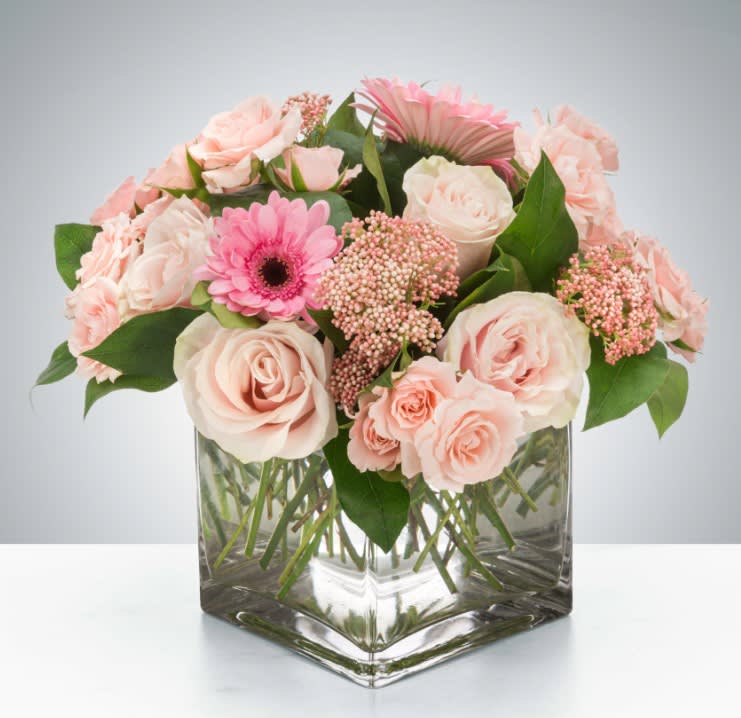 Ballet Slipper - A soft and feminine arrangement, in a clear vase with varieties of pink blooms. Whether sending best wishes for a new baby, birthday or general cheer up, Ballet Slippers is a great gift for the pink lover in your life.  Exact flower selection may vary by the season, but this style will be maintained. 