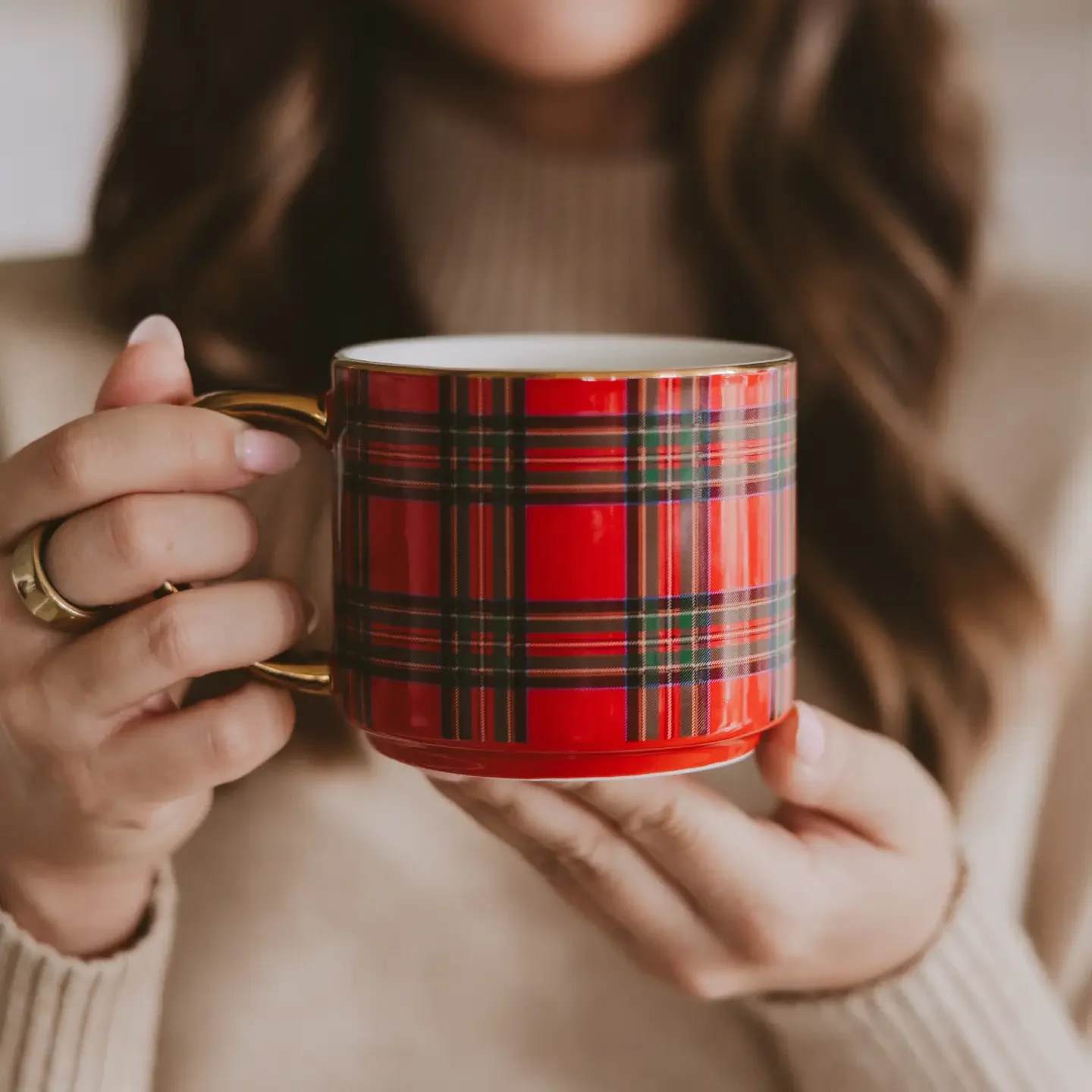 Red Plaid Coffee Mug - Add a classic touch to holiday displays with our 14oz red plaid mug, featuring a festive pattern and gleaming gold handle. Perfect for peppermint lattes, cocoa by the fire, and cozy gatherings, it’s a timeless piece for Christmas decor, seasonal drinkware collections, and thoughtful holiday gifting.  Add our matching candle for the perfect pairing!  DETAILS:  • 14oz Fine Bone China • Size: 3.20&quot; H x 3.75&quot; W (5.45&quot; w/ handle) • Original Design: Red Plaid • Design All Around Mug • Real Gold Details on Rim and Decal • Stackable with other 14 oz Sweet Water Decor Gold Handle Mugs • The design printed on each mug may vary slightly from one mug to another • Designed in the USA, Imported • Style No. CM193  CARE:   • Hand Wash to Preserve Gold Finish • Wash Before Use and Avoid Abrasive Cloths When Cleaning • Do Not Microwave  