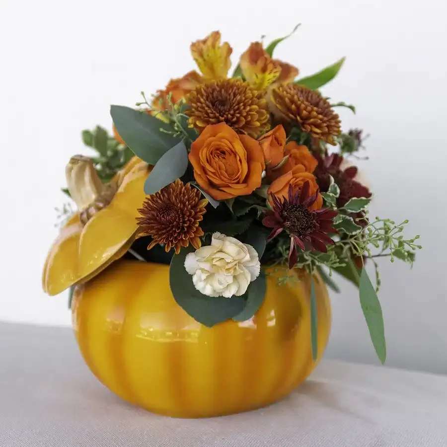 Classic Pumpkin Classic Pumpkin - A festive collection of fall blooms are a perfect way to compliment this glazed ceramic pumpkin container. The keepsake pumpkin can be used every year filled with fresh flowers or candy treats for years of enjoyment! Why not spice up your holidays with this delightful bouquet!