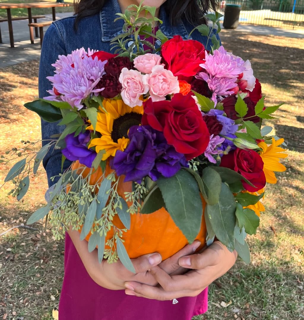 Pumpkin Bloom - Our Flower-in-Pumpkin arrangements celebrate fall with a chic, natural twist. We hollow and seal each real pumpkin, then design a lush garden of seasonal blooms—think dahlias, roses, ranunculus, mums, eucalyptus, and delicate accents—styled in your chosen color palette.