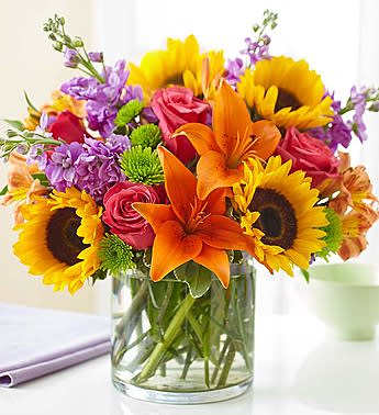 Sun Day Sun Day - With sunflowers and roses lilies.