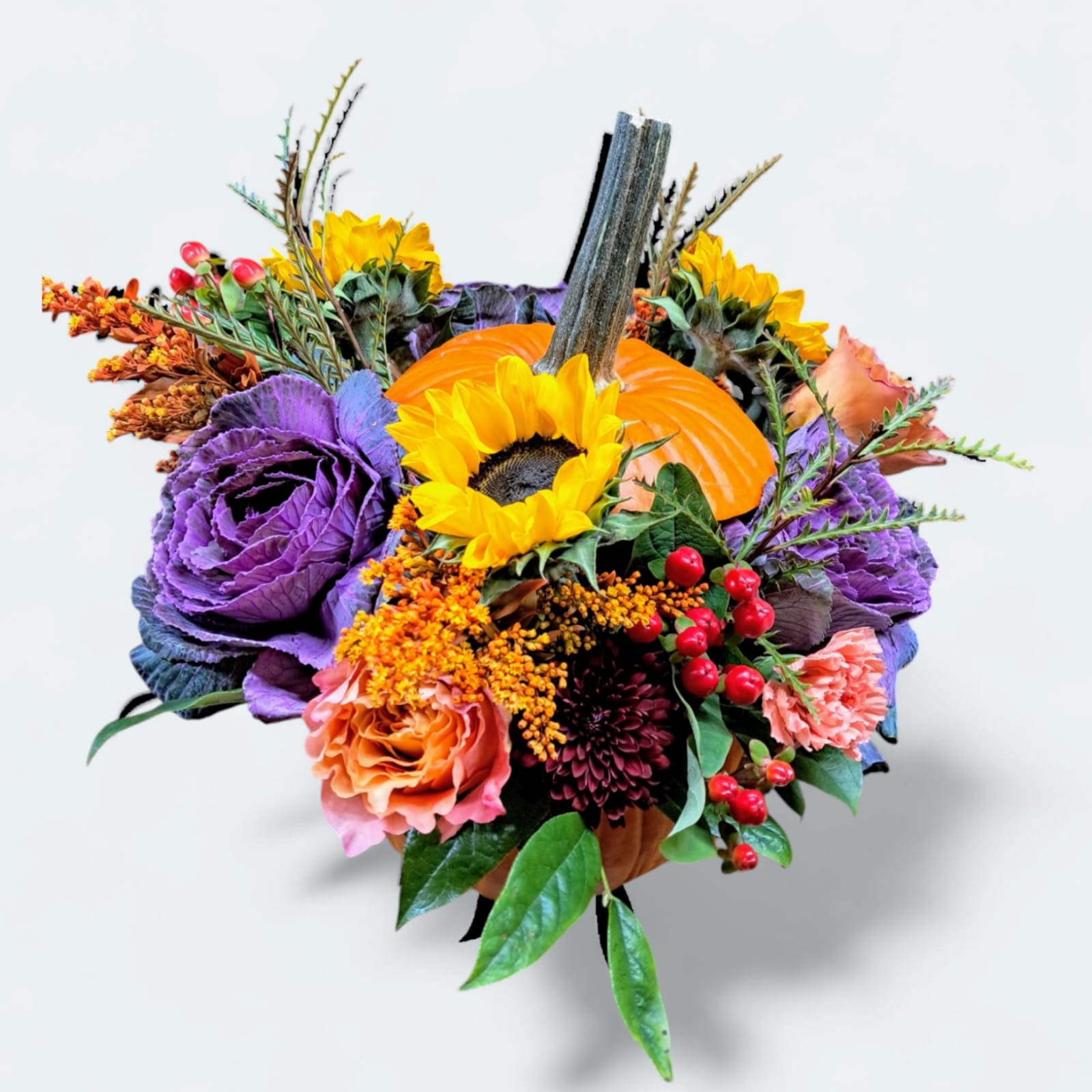 Floral Pumpkin Floral Pumpkin - This beautiful pumpkin arrangement has kales, roses, sunflowers, solidago, hypericum, carnations, and chrysanthemum.