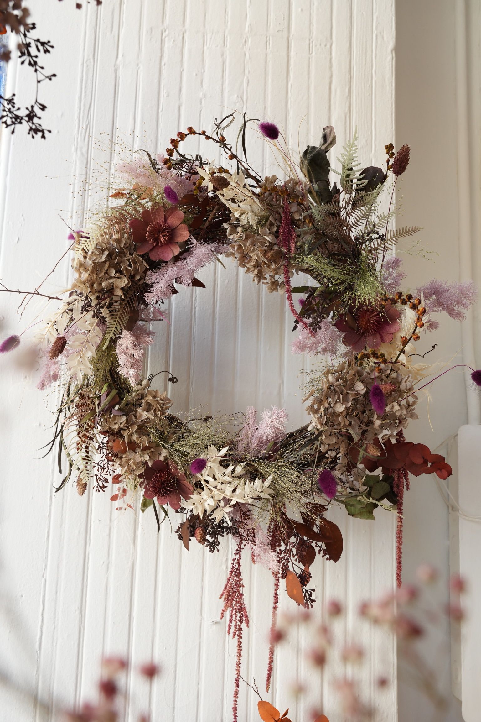 Fall Dried Floral Wreath Fall Dried Floral Wreath - A beautiful, all-natural wreath handcrafted with a mix of dried florals, grasses, and textured foliage in warm autumn tones. Each piece is unique and designed to bring a cozy, seasonal feel to your space — perfect for doors, walls, or above your mantel.  Every wreath is made to order and can be customized to match your preferred colors or style. The photo shown is for reference — if you have something specific in mind, just let us know and we’ll create it for you!  Size - 14 in