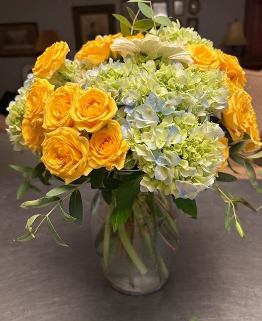Beautiful! Beautiful! - Extremely lovely bouquet of pale blue green hyrangea clustered with brilliant yellow roses arranged in a clear glass vase with accents of feathered eucalyptus. Pure, elegant, long lasting and BEAUTIFUL!