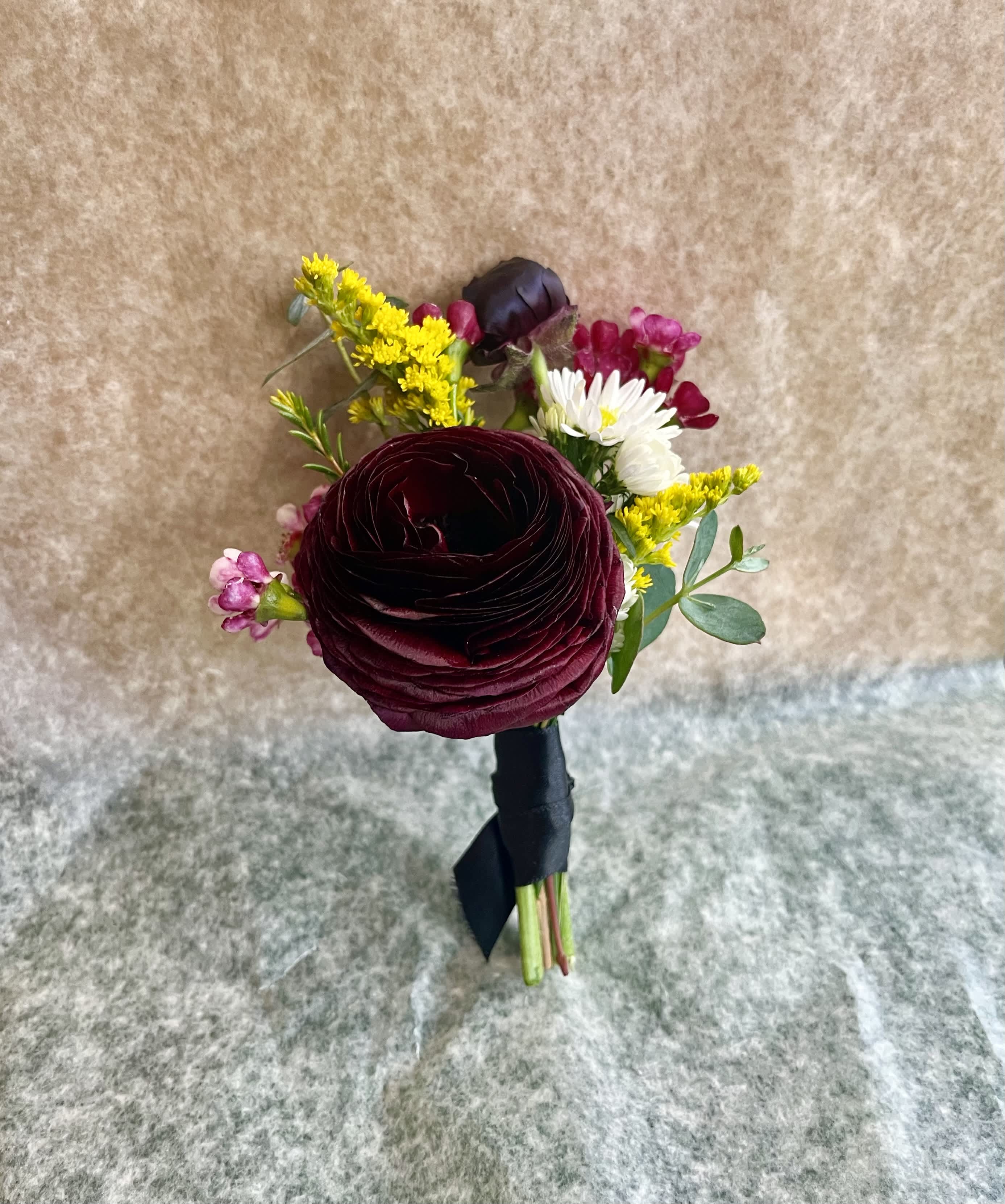 MODERN BOUTONNIERE MODERN BOUTONNIERE - The modern boutonniere will include a mix of texture, colors and seasonal flowers to create a more modern look