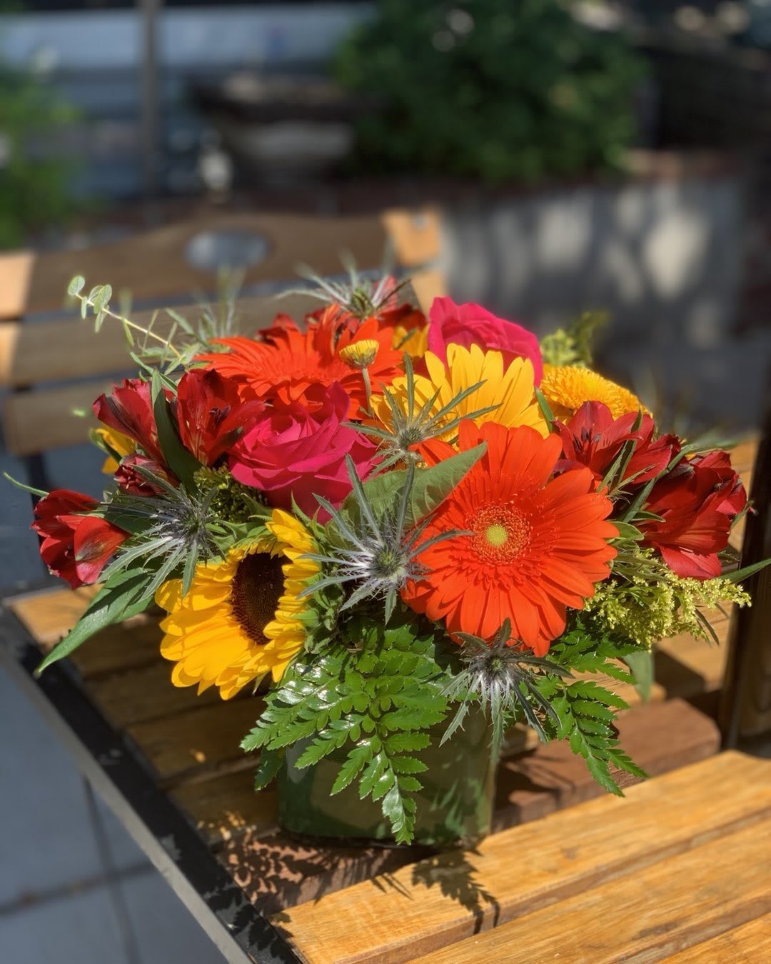 Brilliant Bright Blooms with roses Brilliant Bright Blooms with roses - We arrange all the freshest and brightest blooms available in a vase. Sunflowers may be substituted.
