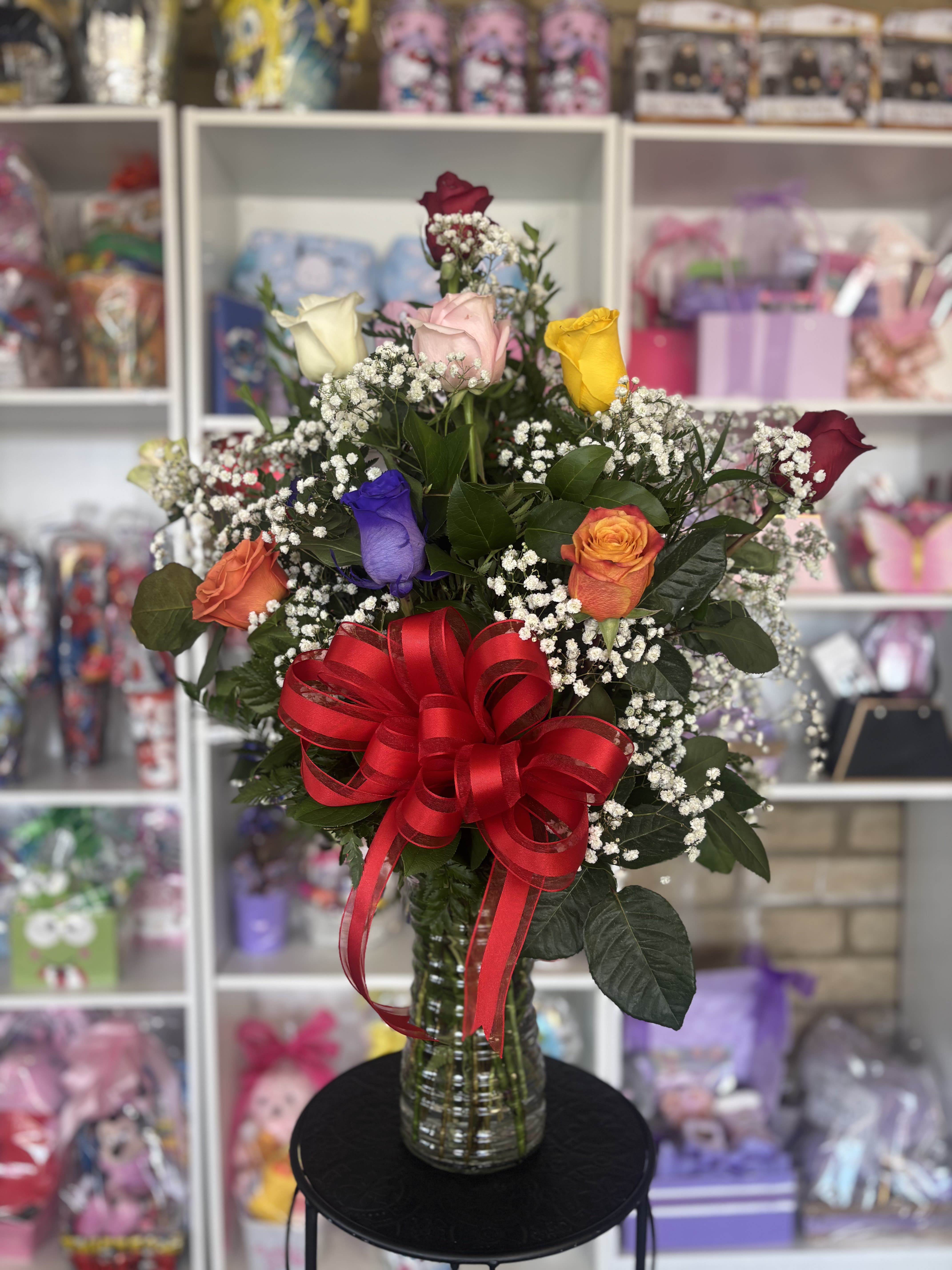 Colorful Roses  - Twelve color Roses  in vase  with greenery and baby breath 