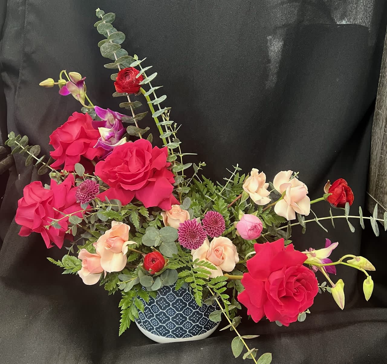 The Heartthrob The Heartthrob - Perfect for your special someone, more of a modern and contemporary style, designed using reflexed hot pink roses, light pink spray roses, fuchsia dendrobium orchids, and eucalyptus foliage.