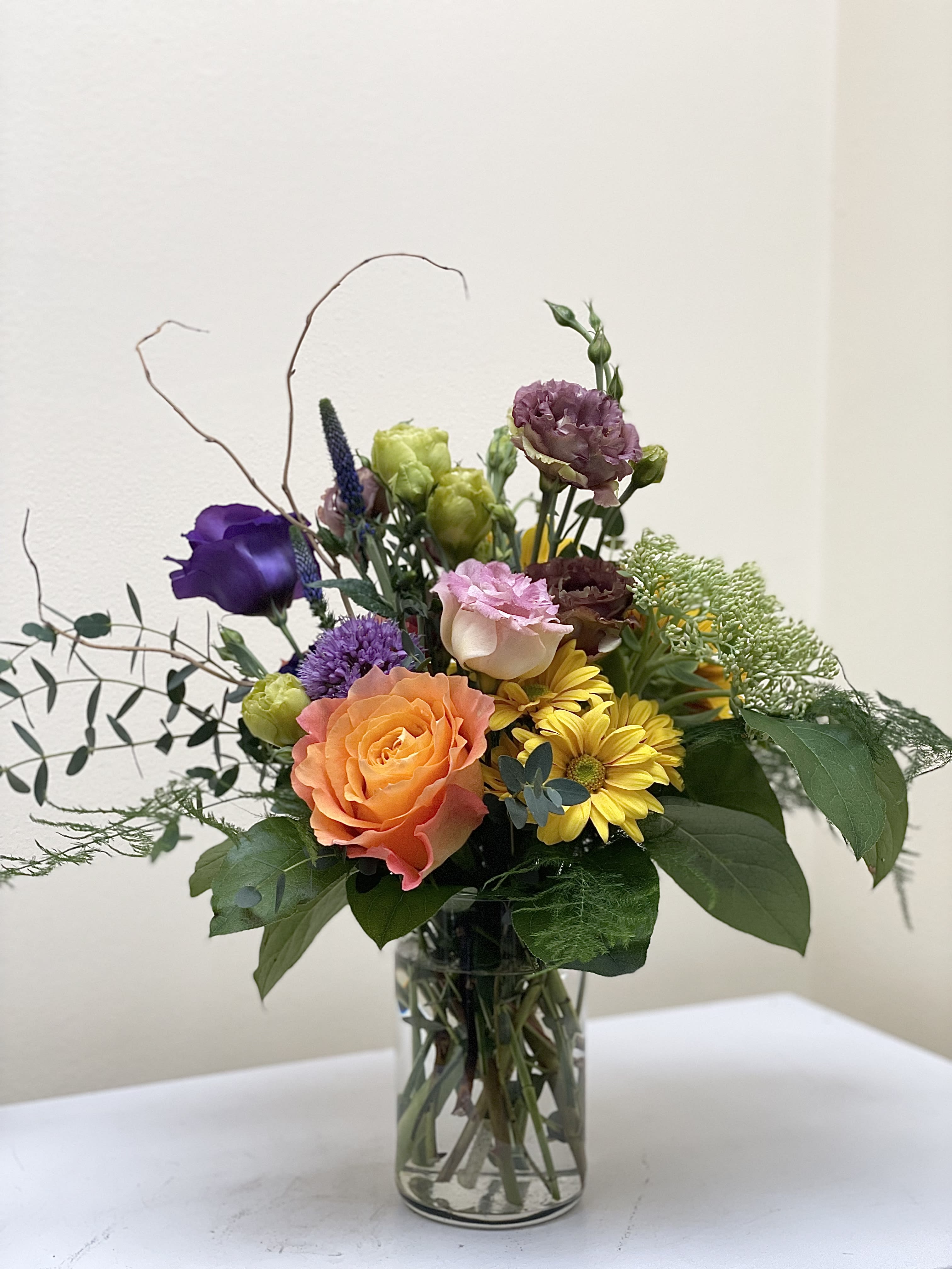 Blooms of Color - Perfect arrangement of fall blooms, we buy local and the design will reflect the picture but might have different blooms depending what our flower farmers supply and weather conditions.