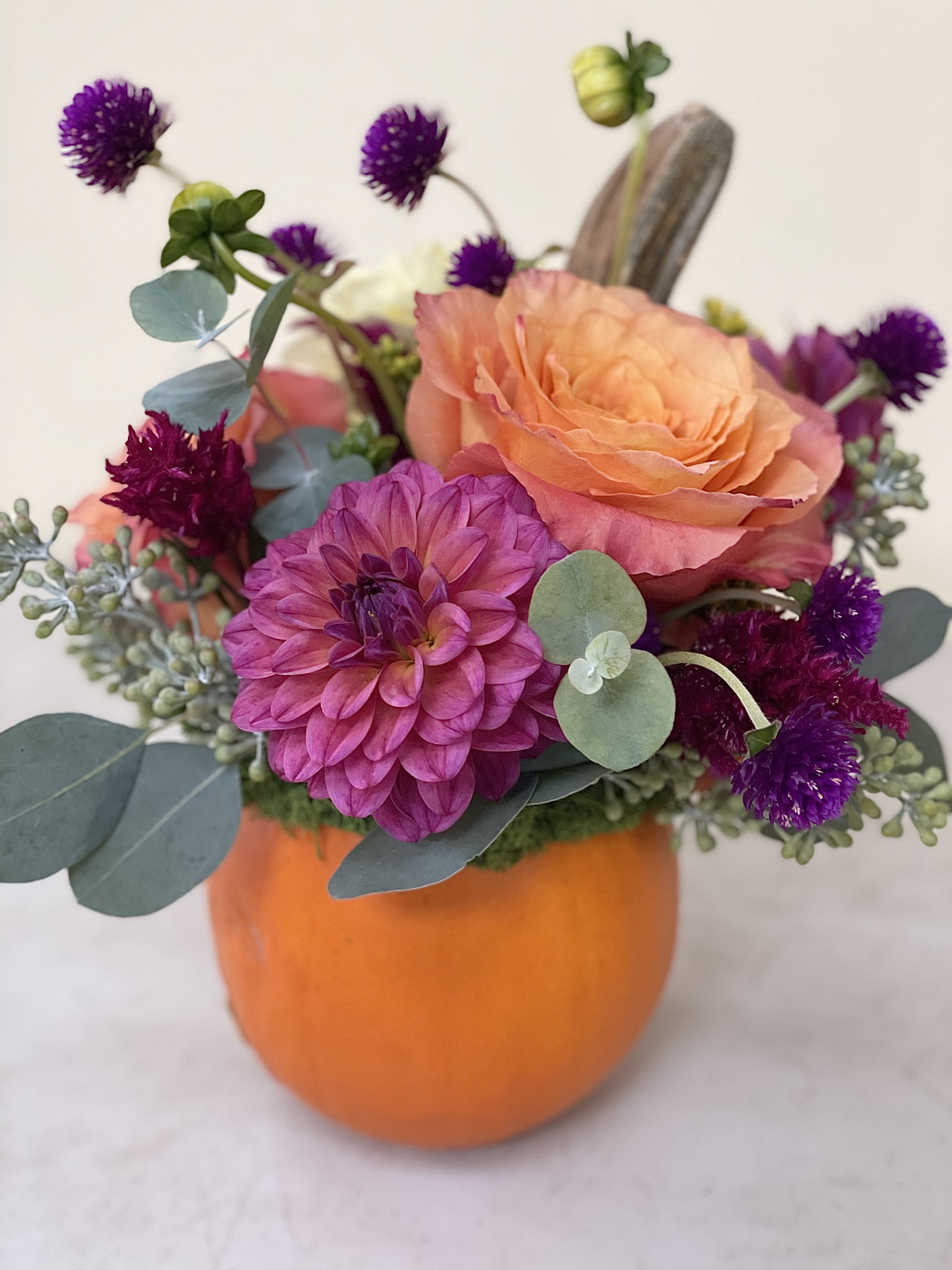 It’s the Season - At this time of the year we love to celebrate with pumpkins so we have incorporated one in this floral design. We also wanted it to be something that was not too big so it could be perfect for a hospital or nursing home table or a work desk or hallway table so everyone can celebrate. Size about 6 x 11