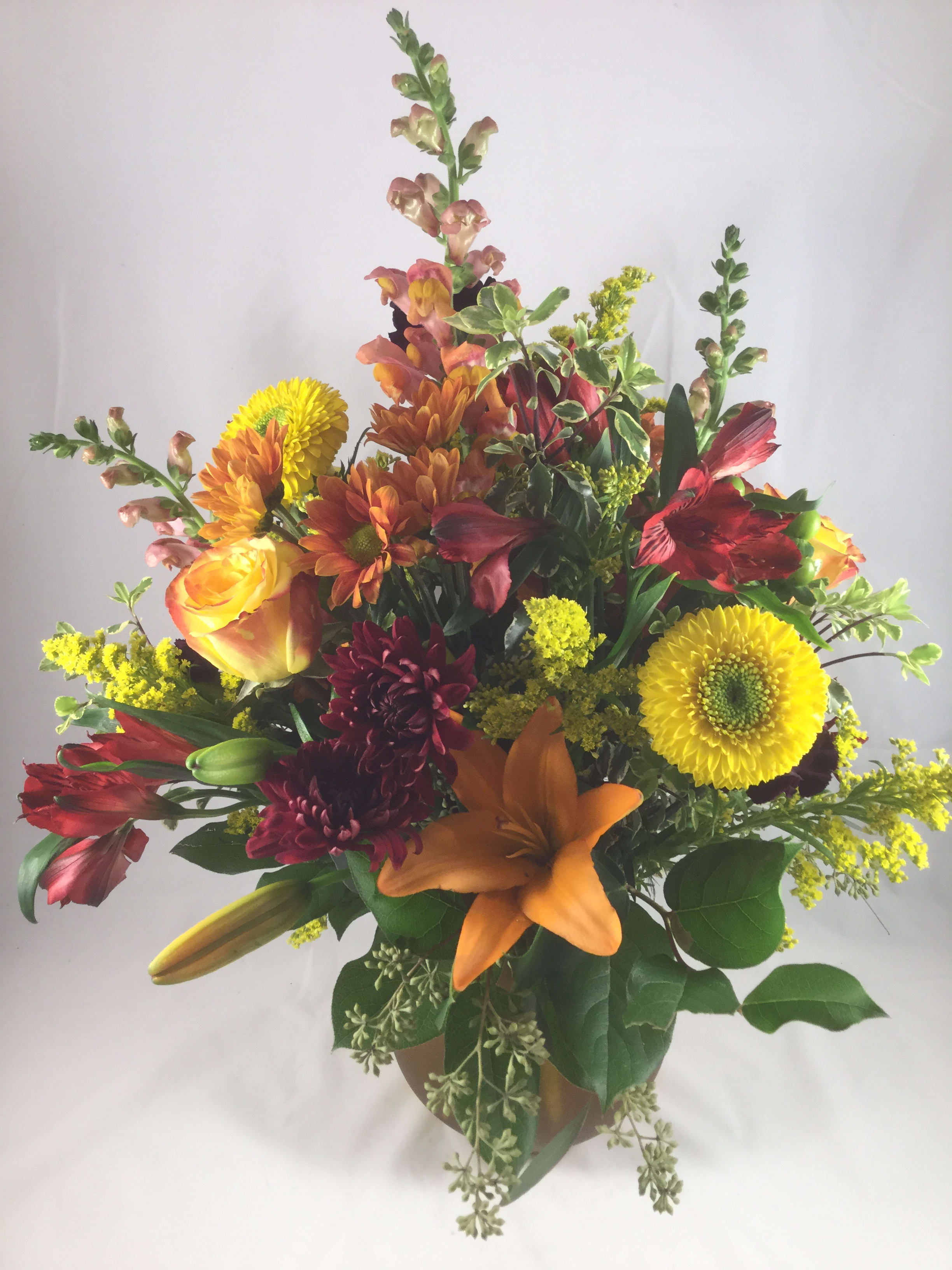 October Sky October Sky - Autumn tones at their finest. A mix of seasonal flowers in a rustic wood cube box