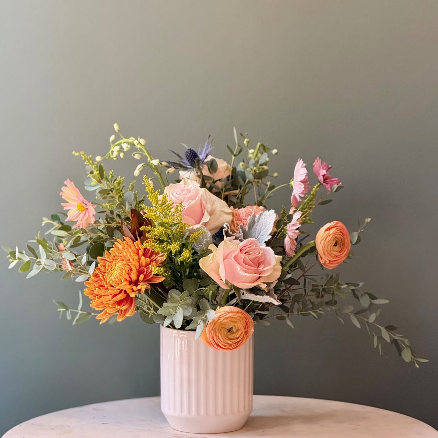 Dreamer's Garden - Beautiful neutral arrangement in a white ceramic vase with fresh blooms of the season! Flowers may vary based on availability and season. Color palette and design will be as close to photos as possible. We can ensure your arrangement will be beautiful and fresh! 