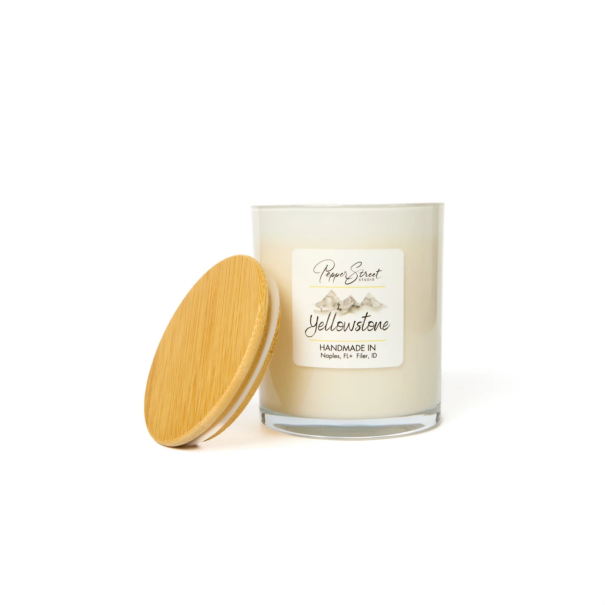 YELLOWSTONE CANDLE YELLOWSTONE CANDLE - Experience eco-conscious luxury with Pepper Street's 13-ounce soy wax candle. Crafted with toxin-free fragrances, it provides a clean, safe burn. The wood wick adds natural elegance and a subtle crackle for peacefulness and tranquility. Ideal for those who value high-quality, sustainable products. Burn time is 80+ hours. For best results, burn the candle for 2-3 hours until the wax melts evenly. Always trim the wick before lighting. Yellowstone Embrace the rugged and refreshing scent of cedarwood, pine, and amber.